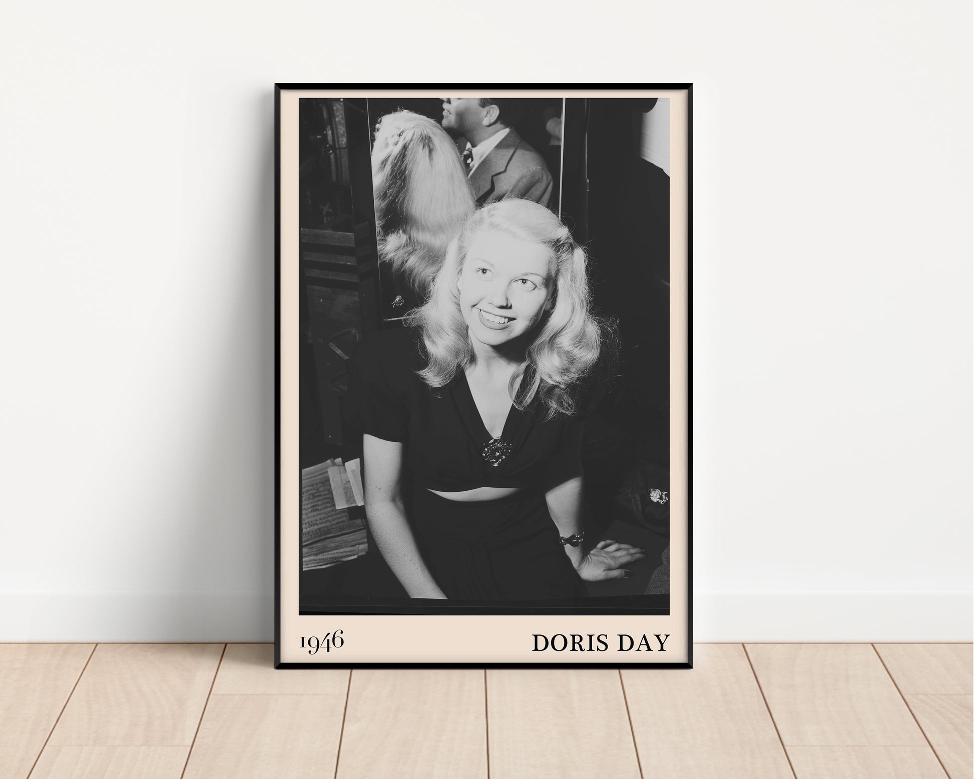 1946 photograph of  Doris Day. Transformed into a stylish black-framed jazz poster resting against a white wall