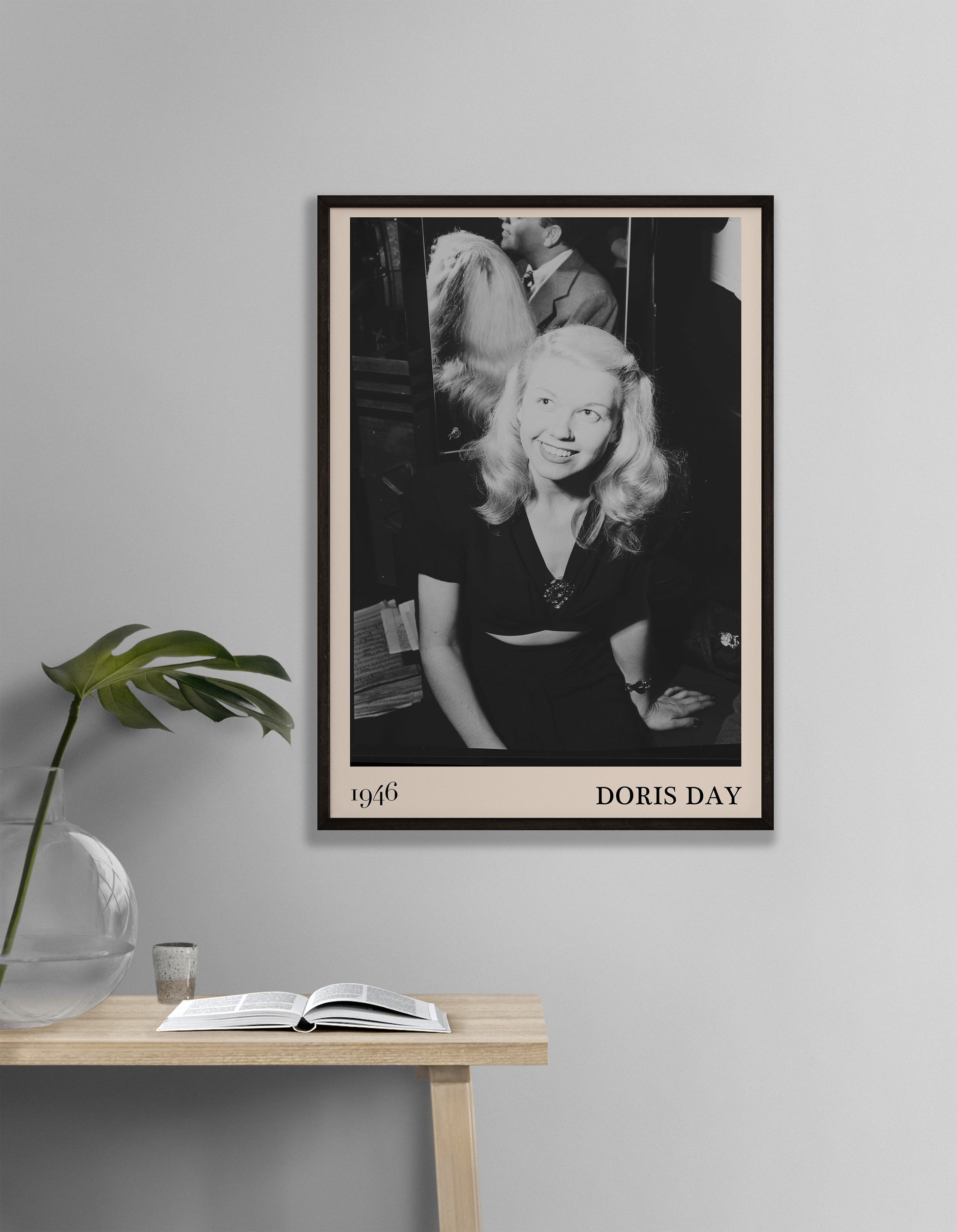 1946 photograph of  Doris Day. Transformed into a cool black-framed jazz poster resting hanging on a grey wall
