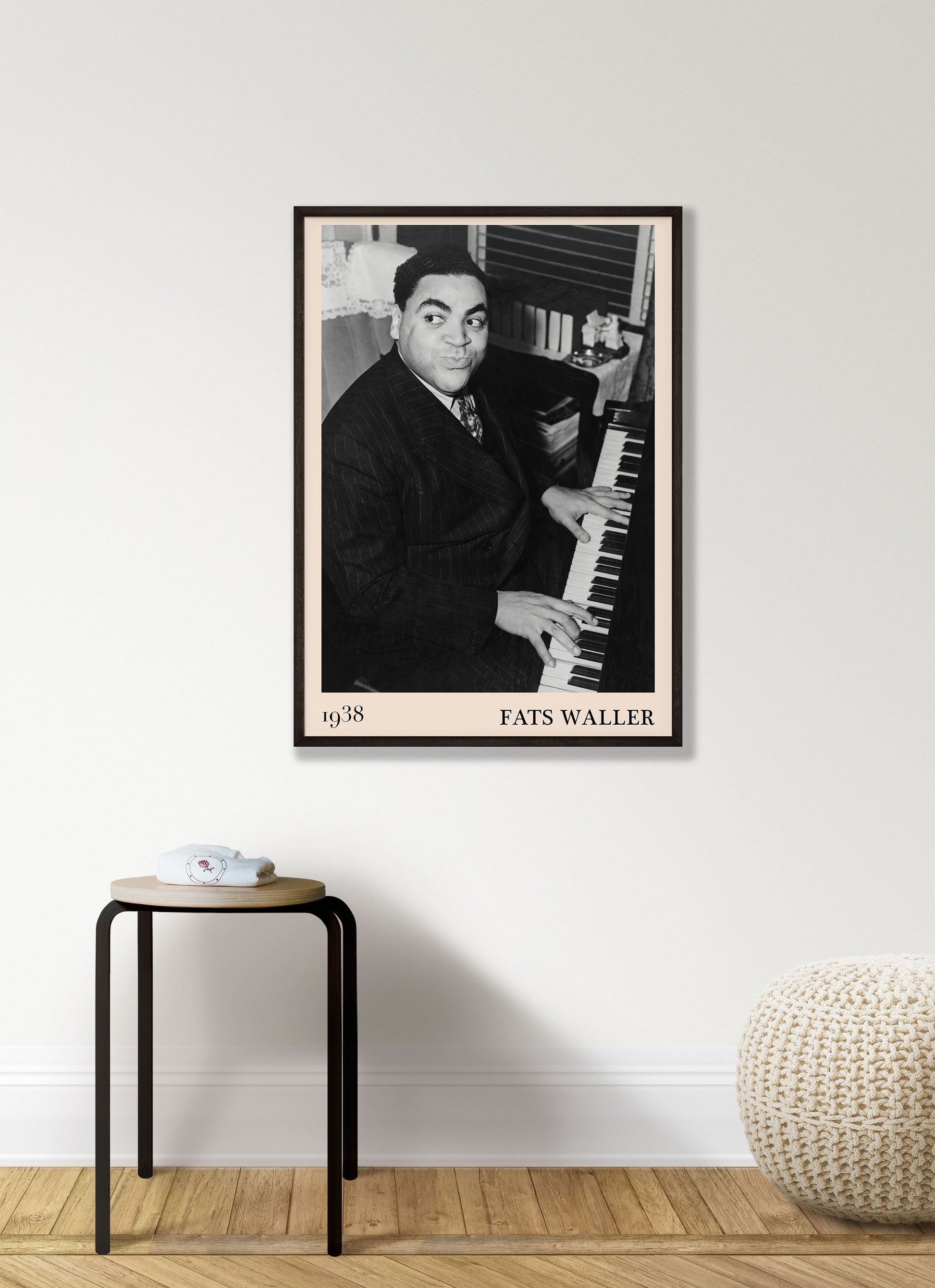 1938 photograph of Fats Waller crafted into a cool black framed jazz print. The poster is hanging on a white living room wall.