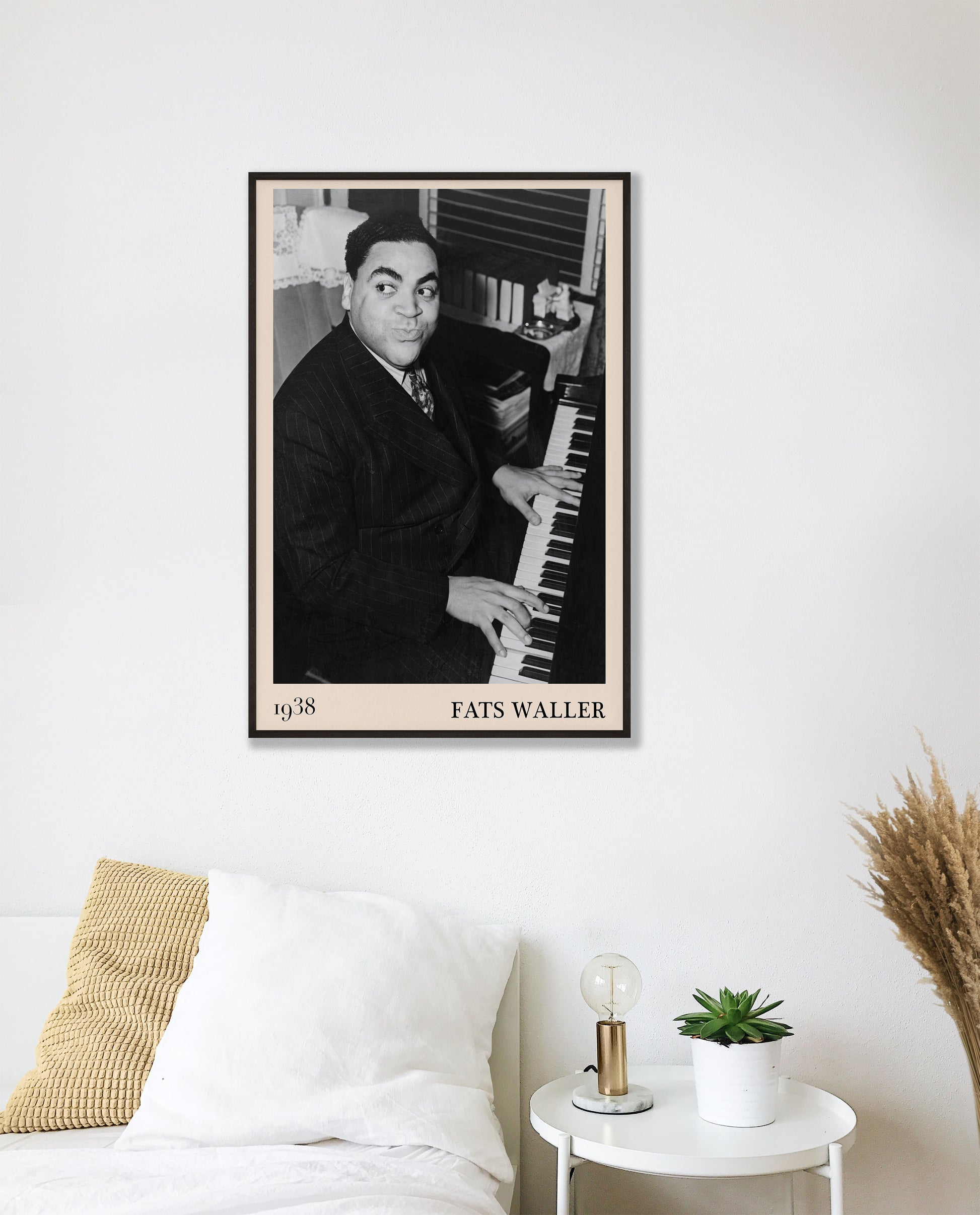1938 photograph of Fats Waller crafted into a cool black framed jazz poster. The poster is hanging on a white bedroom room wall.