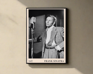 1947 photo of Frank Sinatra crafted into a black framed-poster, hanging on a yellow wall