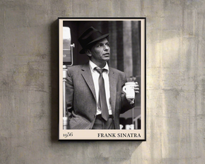1956 photo of Frank Sinatra crafted into a black framed-poster, hanging on a rustic concrete wall