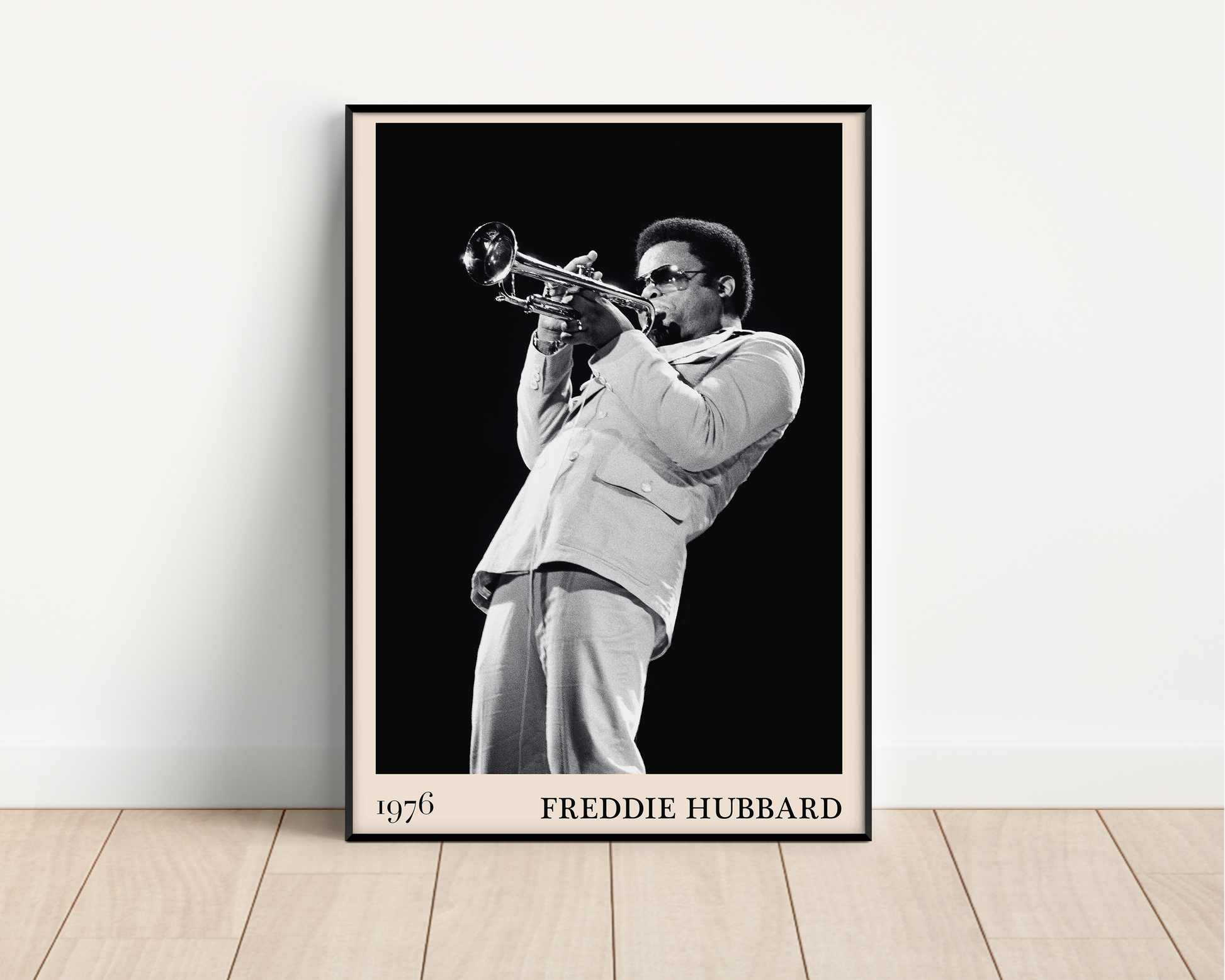 1976 photograph of Freddie Hubbard taken by Thomas Marcello. Picture crafted into a black framed poster, with an off-white border. Poster is propped against a white wall
