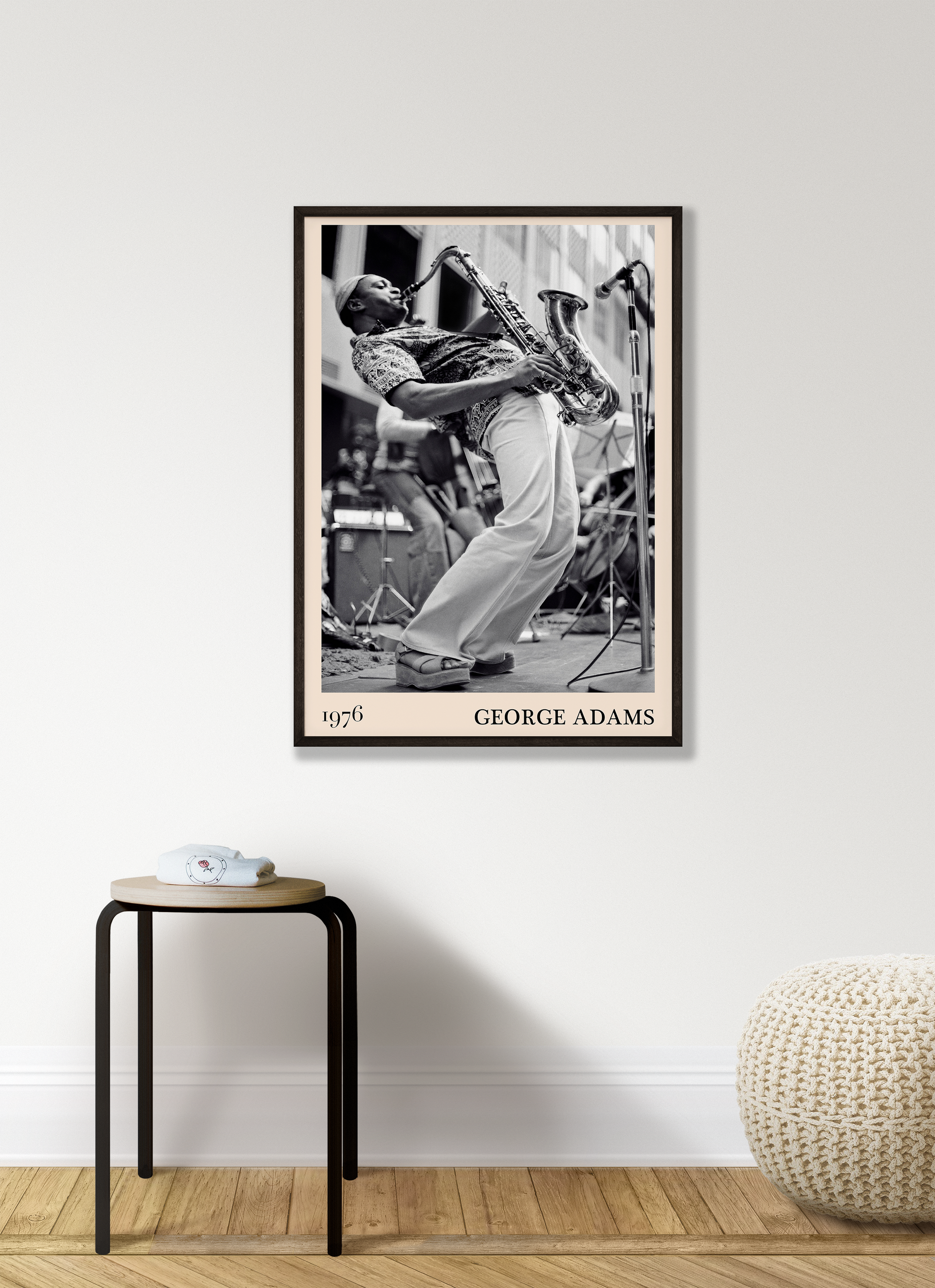 1976 photograph of George Adams taken by Thomas Marcello. Picture crafted into a cool black framed jazz print, with an off-white border. Poster is hanging on a white living room wall.