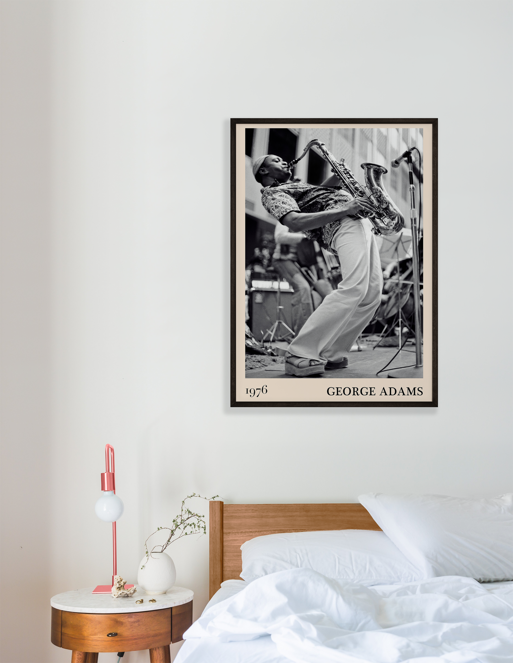 1976 photograph of George Adams taken by Thomas Marcello. Picture crafted into a cool black framed jazz print, with an off-white border. Poster is hanging on a white bedroom wall
