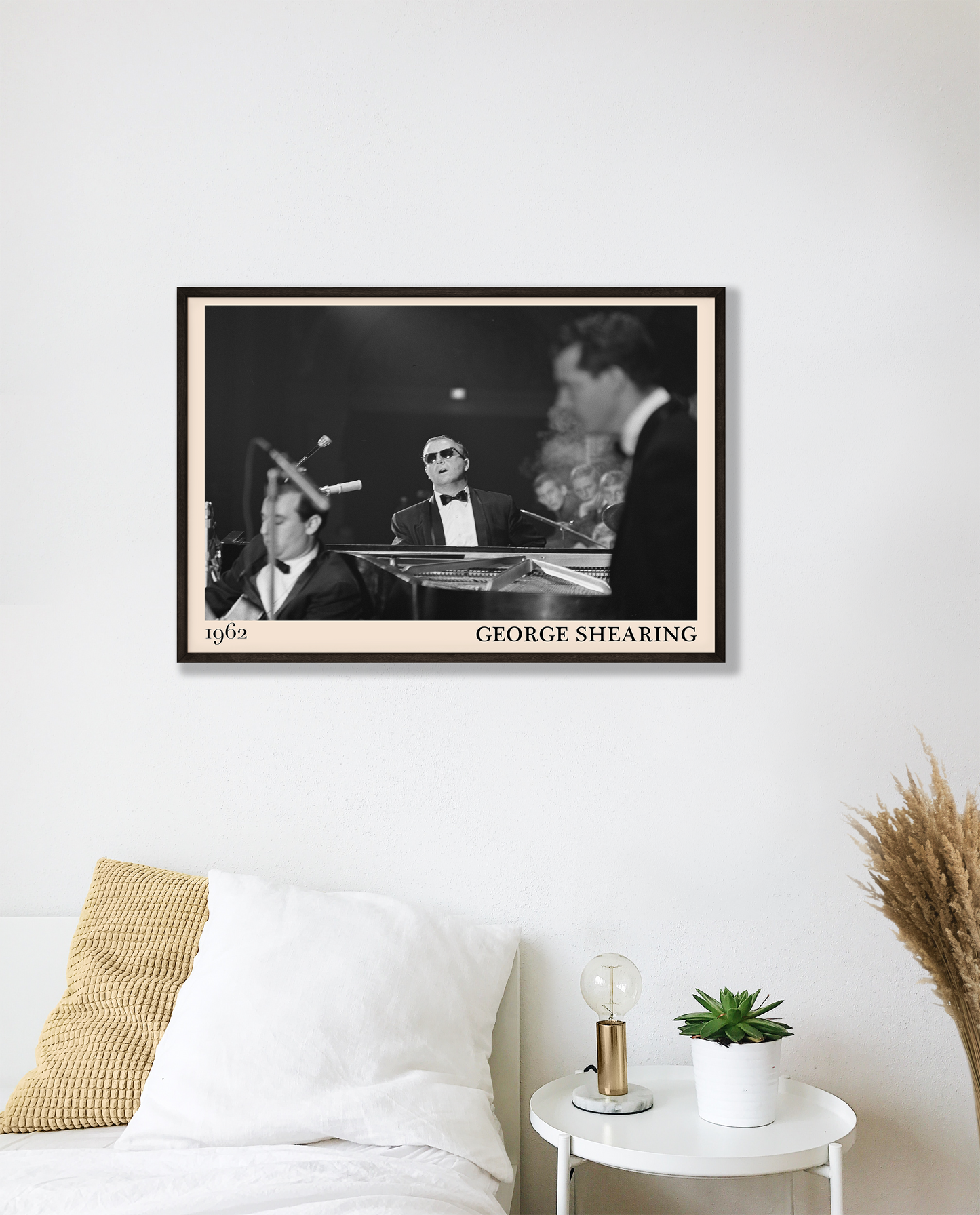 1962 picture of George Shearing playing piano. Picture crafted into a cool black framed music poster, with an off-white border. Poster is hanging on a white bedroom wall