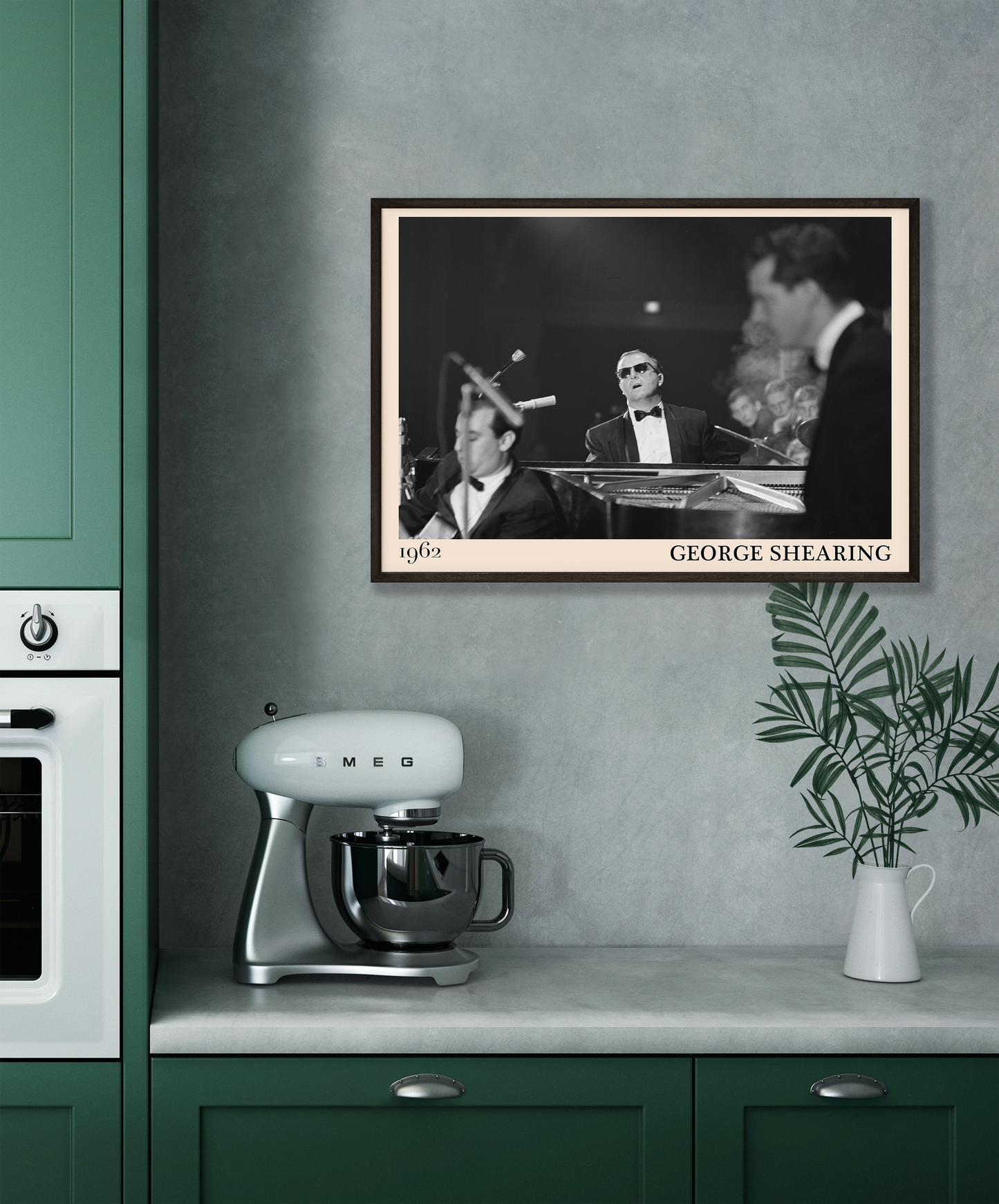 1962 picture of George Shearing playing piano. Picture crafted into a cool black framed music print, with an off-white border. Poster is hanging on a grey kitchen wall.