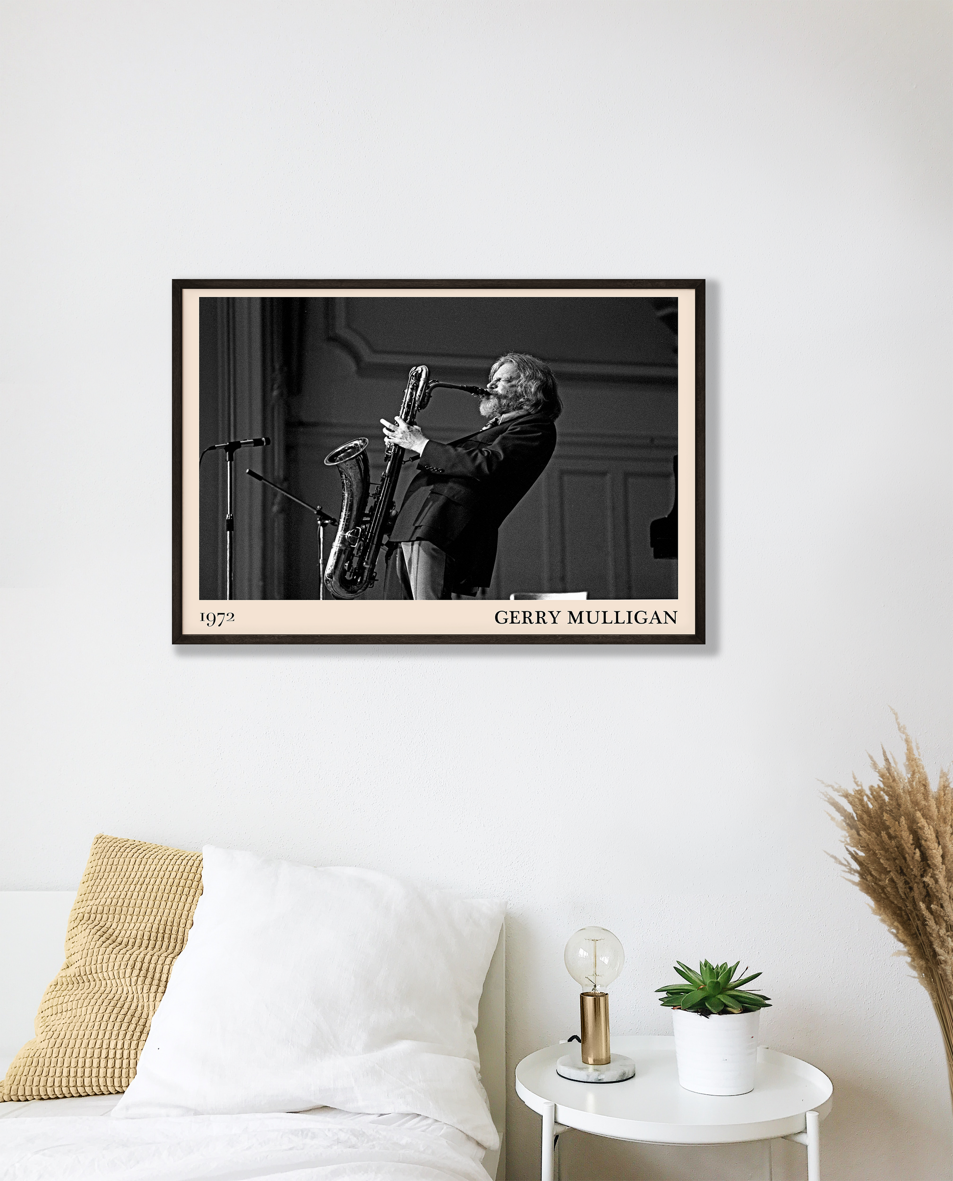 1972 photo of Gerry Mulligan crafted into a black framed-poster, hanging on a white bedroom wall