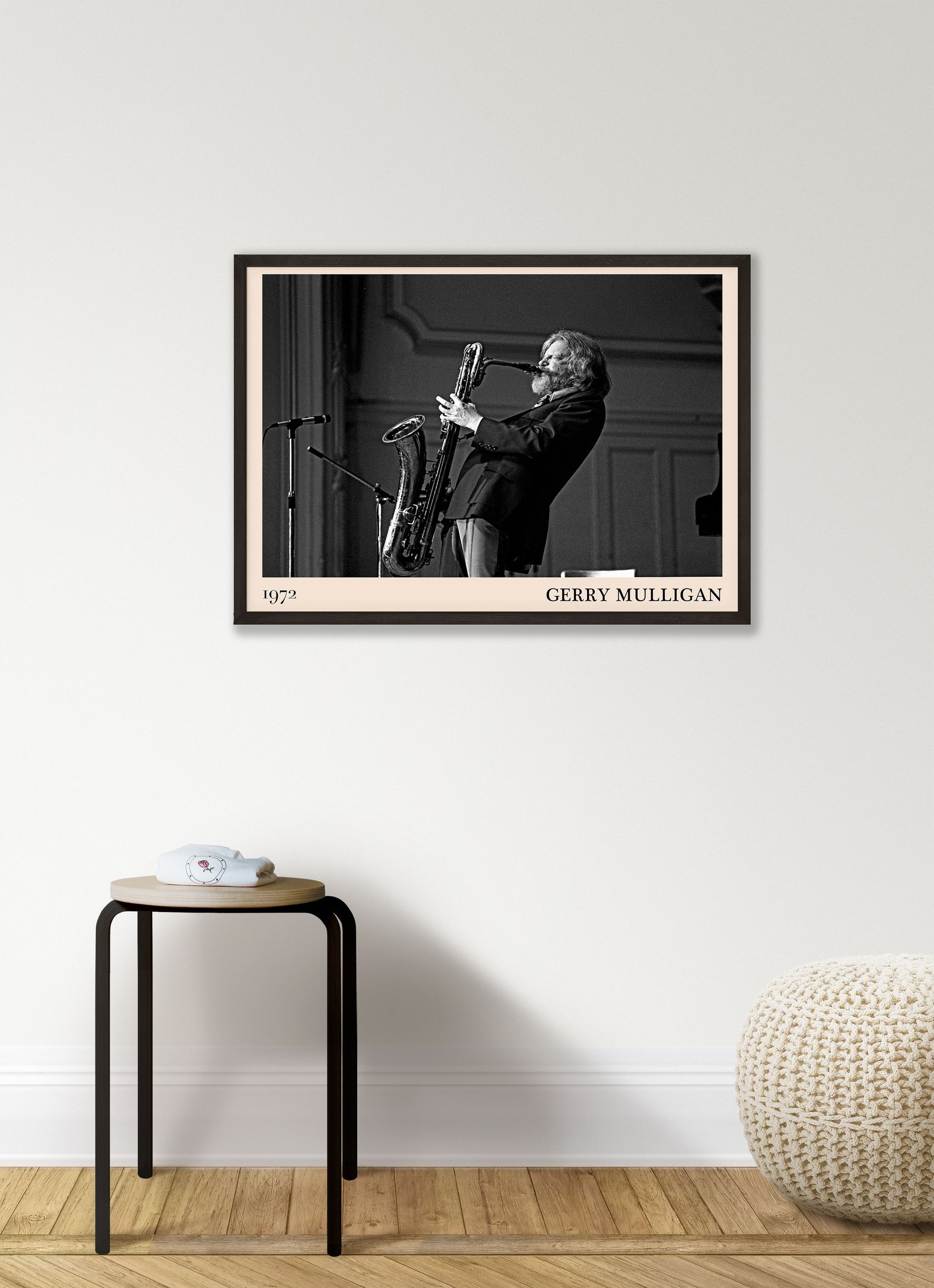 1972 photo of Gerry Mulligan crafted into a black framed-poster, hanging on a white living room wall