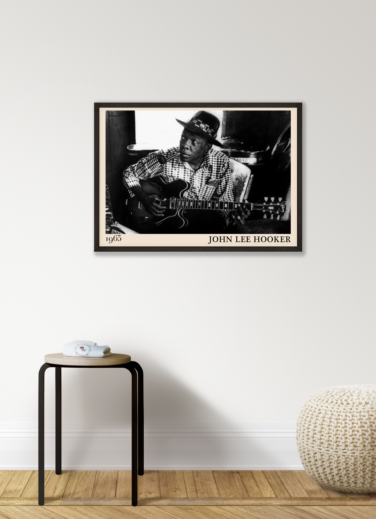 John Lee Hooker blues print hanging against a white wall in a liviing room