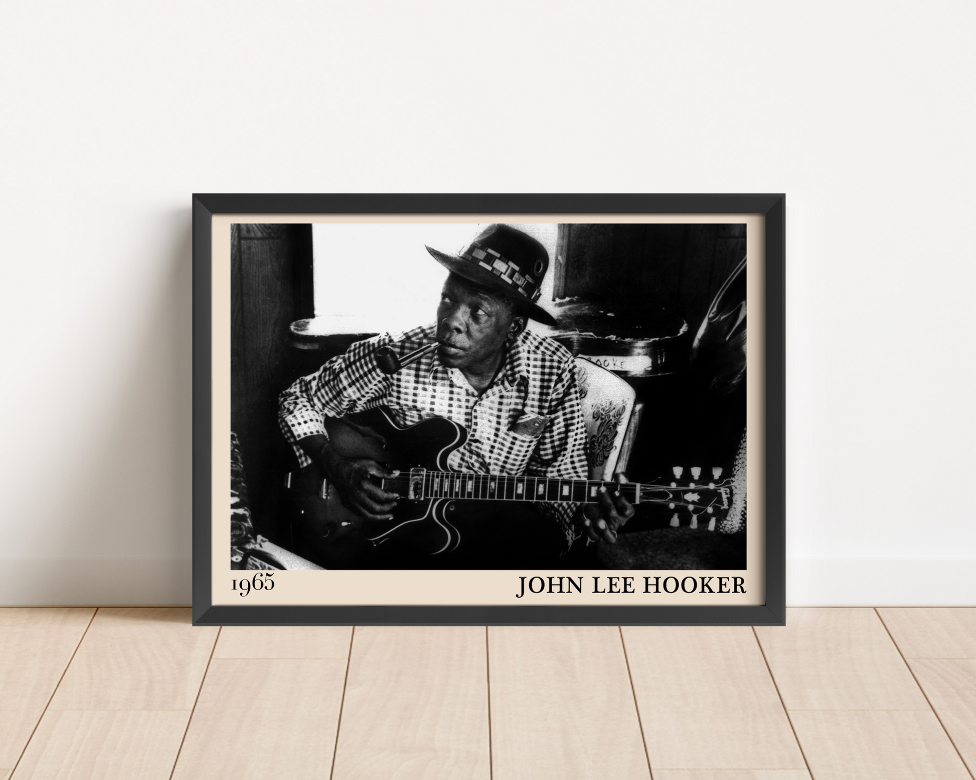 John Lee Hooker blues print leaning against a white wall