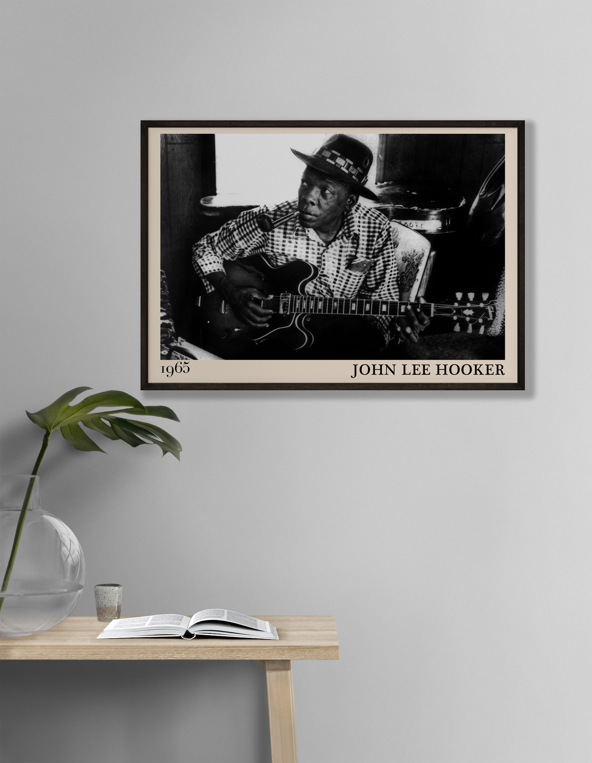 John Lee Hooker blues print hanging against a white wall in a study