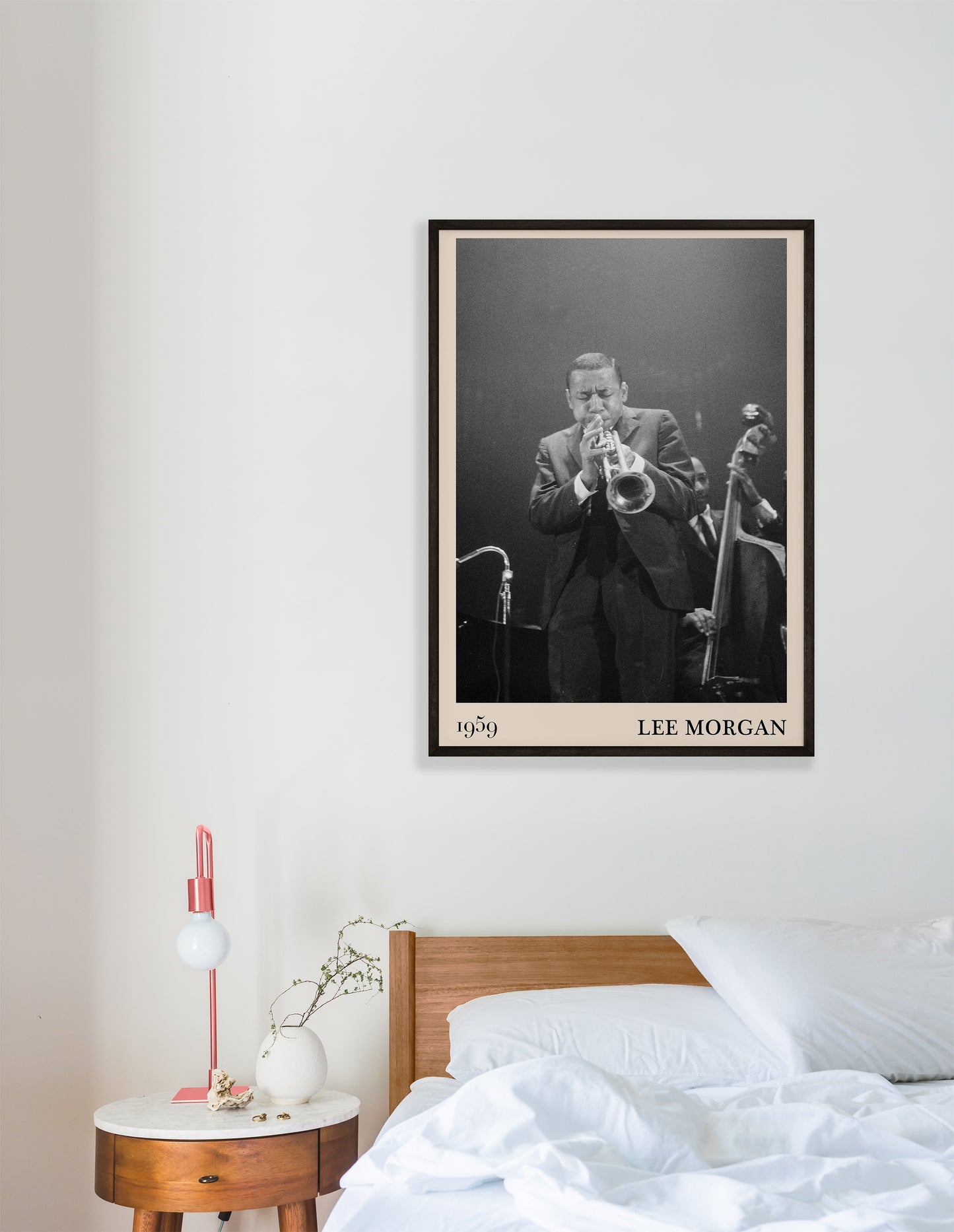 1959  photograph of Lee Morgan playing the Trumpet transformed into a stylish black-framed jazz poster hanging on a white bedroom wall