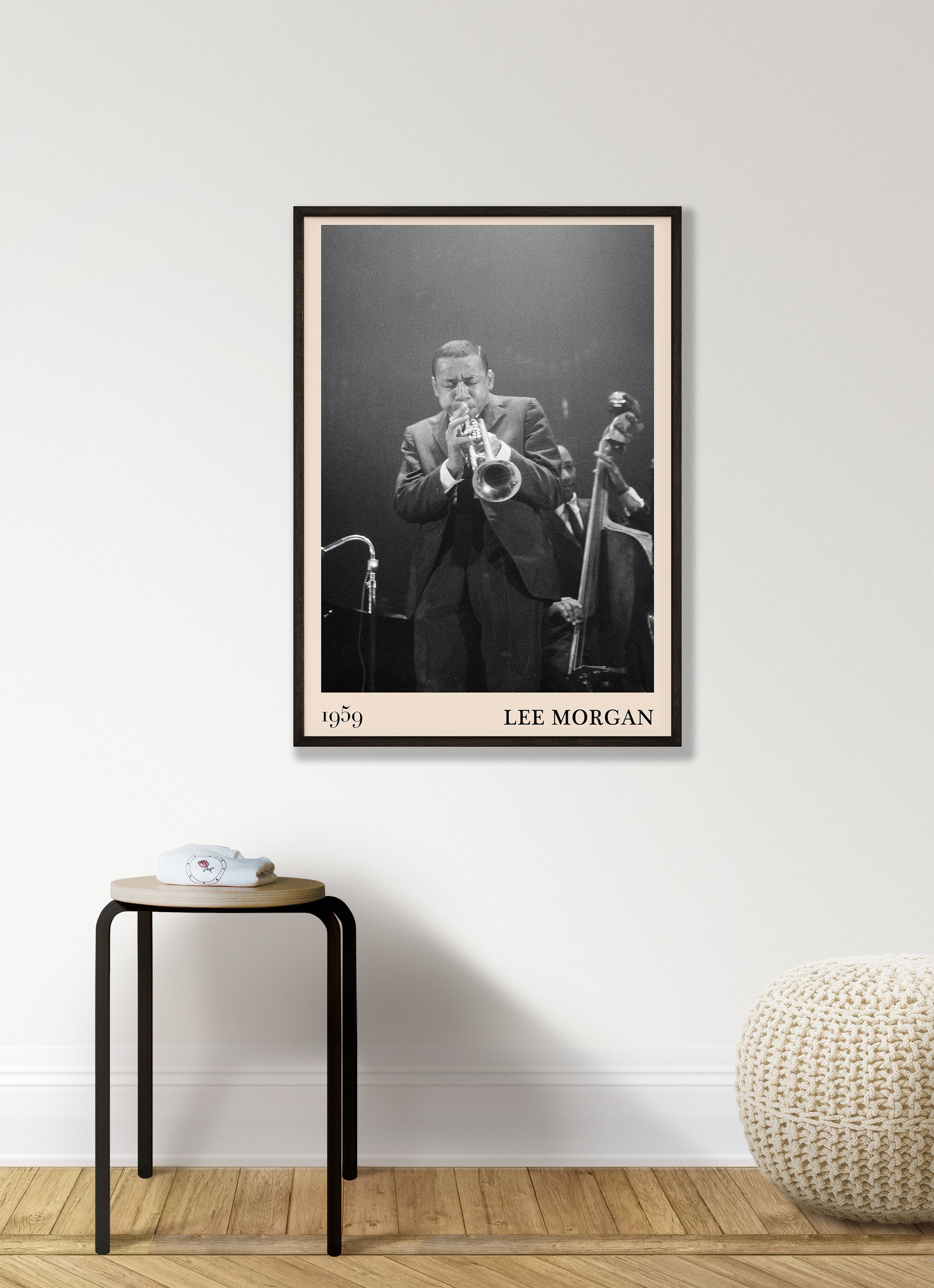 1959 photograph of Lee Morgan playing the Trumpet transformed into a stylish black-framed jazz print hanging on a white living room wall