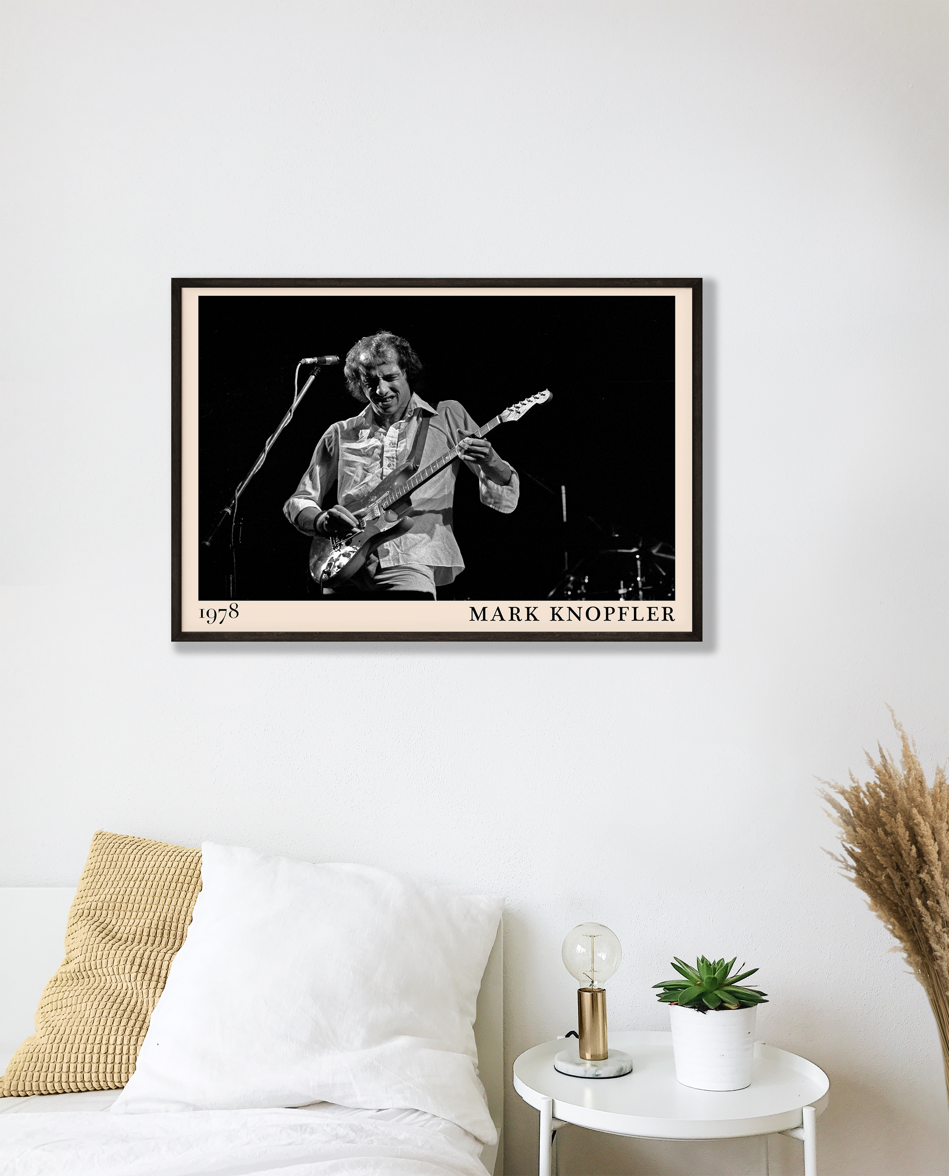 Iconic image of rock legend Mark Knopfler performing, captured by Heinrich Klaffs in 1978 and transformed into vintage-inspired wall decor hanging on a white bedroom wall