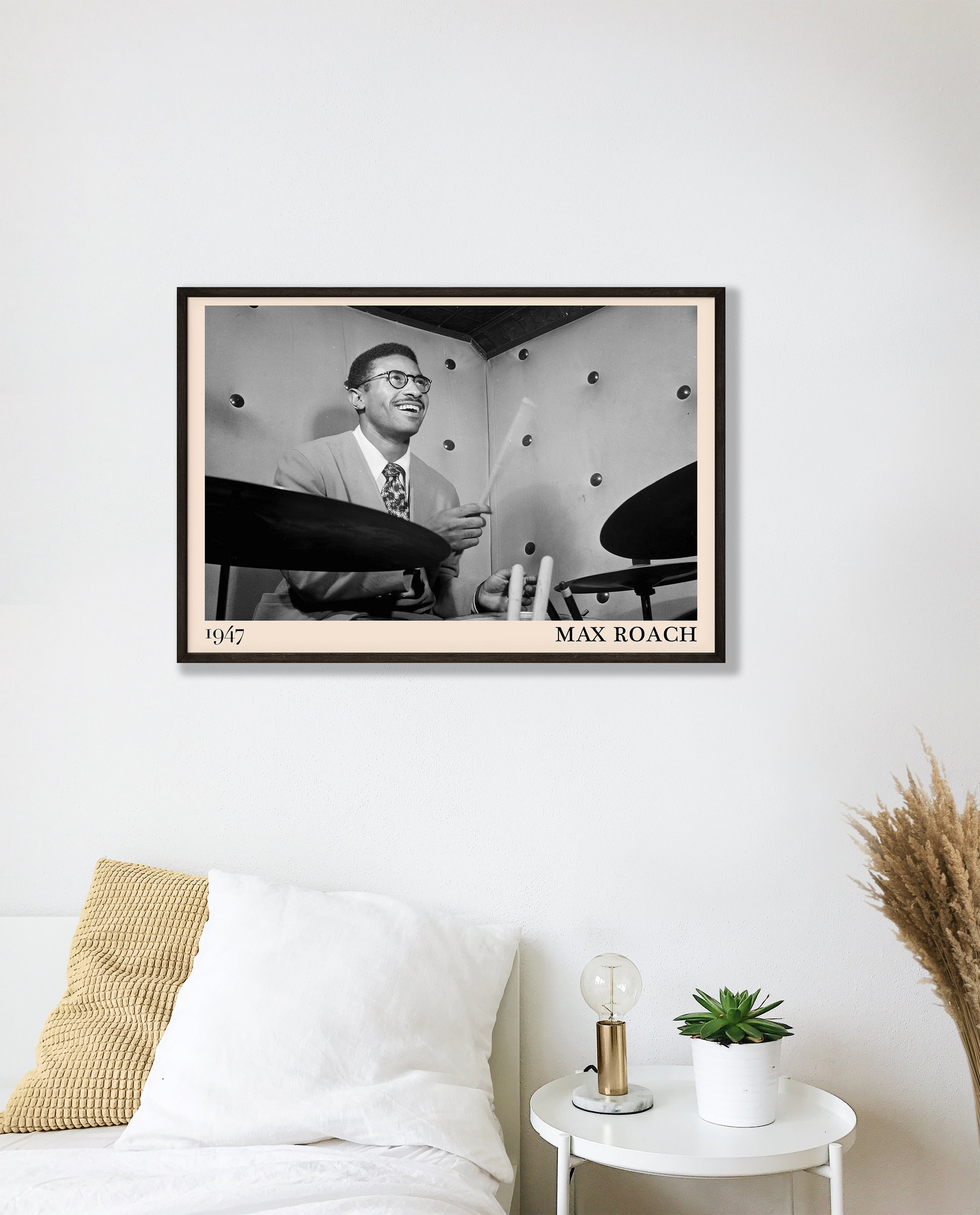 1947 photograph of Sonny Rollins playing the drums, transformed into a cool black-framed jazz poster hanging on a white bedroom wall