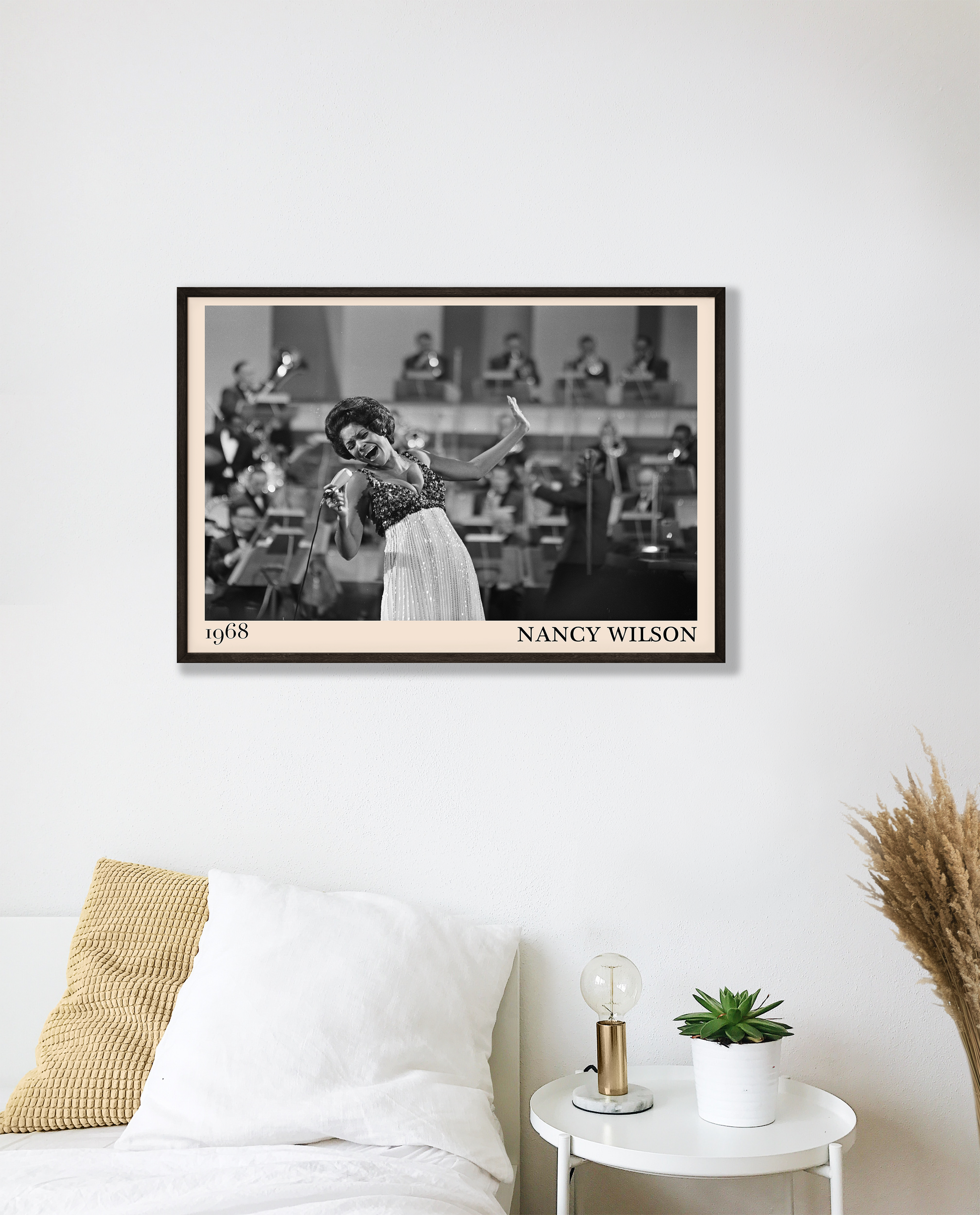 1968 picture of Nancy Wilson singing. Picture crafted into a cool black framed music poster, with an off-white border. Poster is hanging on a white bedroom wall