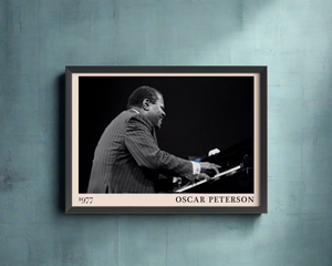 1977 photograph of Oscar Peterson taken by Thomas Marcello. Picture crafted into a black framed poster, with an off-white border. Poster is hanging on a blue wall
