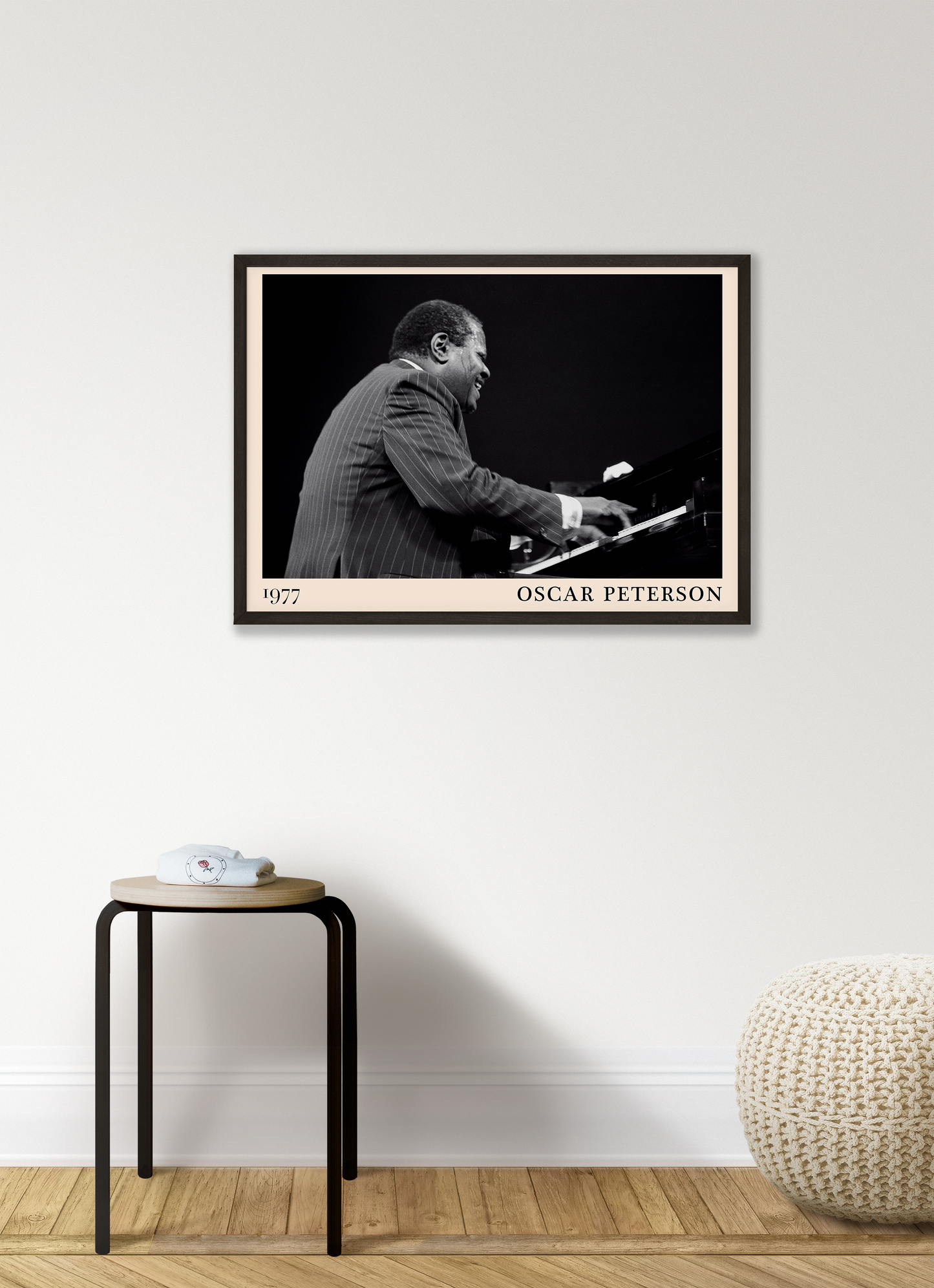 1977 photograph of Oscar Peterson taken by Thomas Marcello. Picture crafted into a cool black framed jazz print, with an off-white border. Poster is hanging on a white living room wall