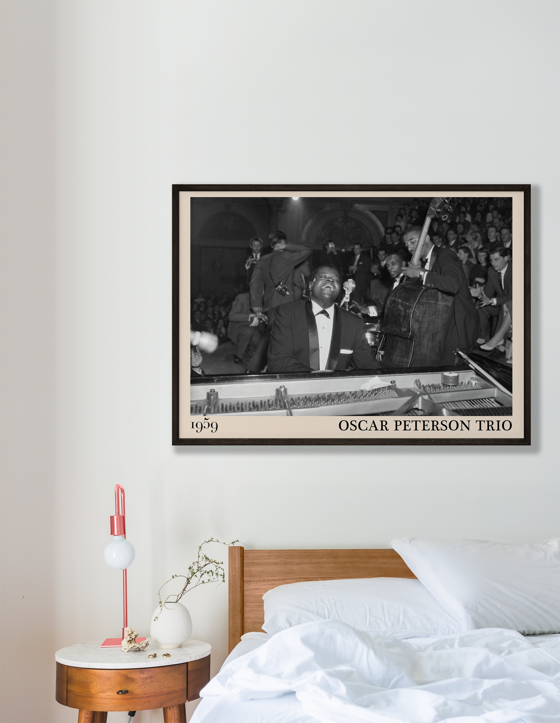 1959 picture of the Oscar Peterson Trio. Picture crafted into a cool black framed jazz print, with an off-white border. Poster is hanging on a grey bedroom wall