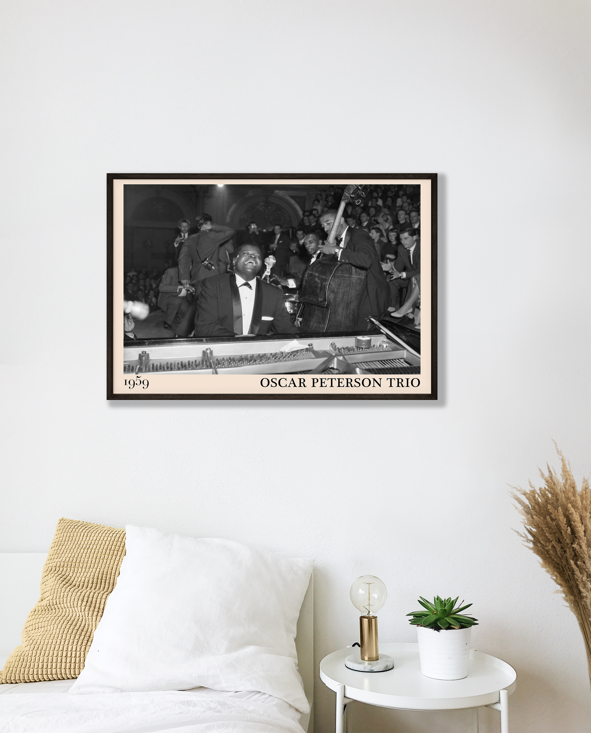 1959 picture of the Oscar Peterson Trio. Picture crafted into a cool black framed music poster, with an off-white border. Poster is hanging on a white bedroom wall