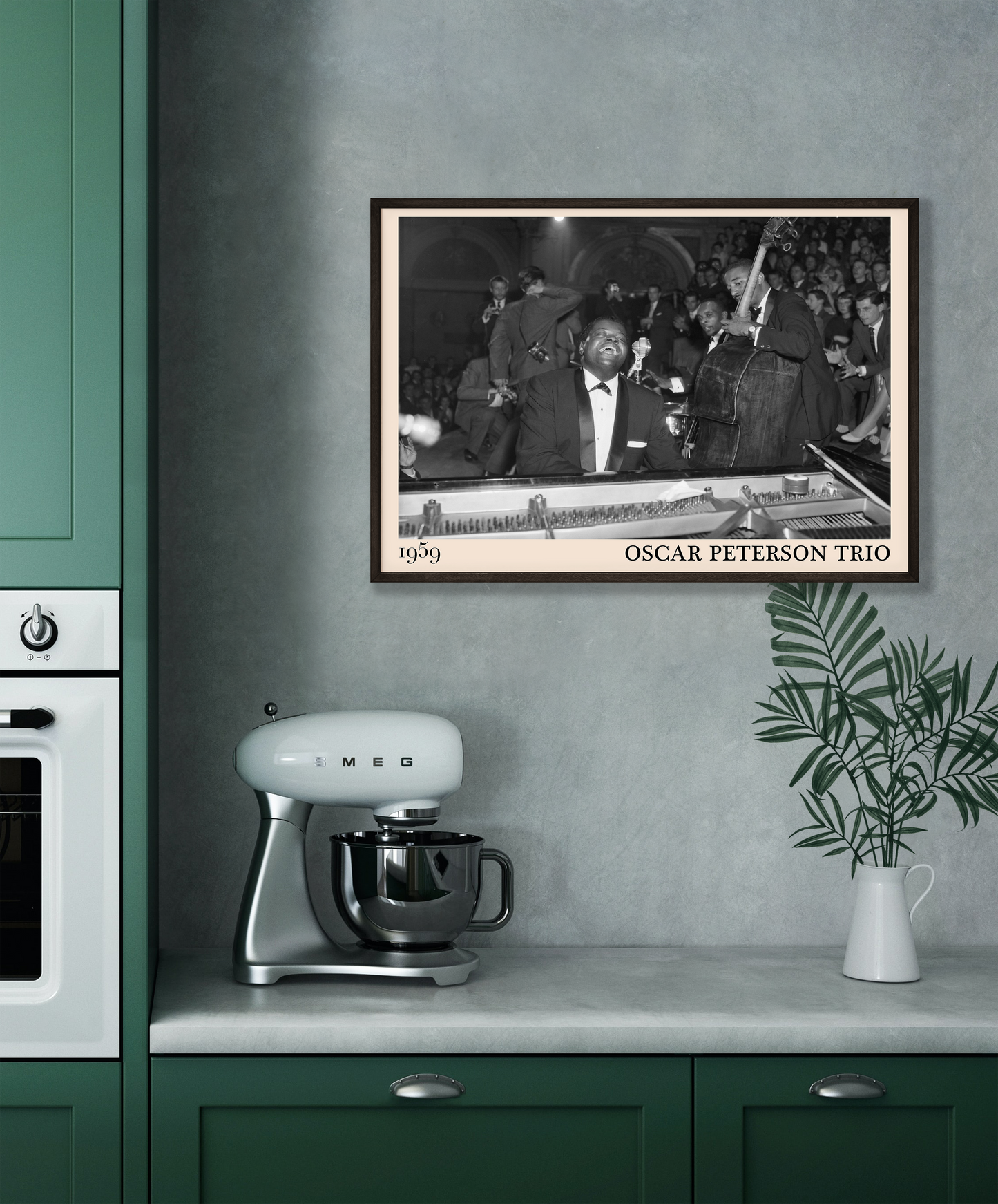 1959 picture of the Oscar Peterson Trio. Picture crafted into a cool black framed music poster, with an off-white border. Poster is hanging on a grey kitchen wall 