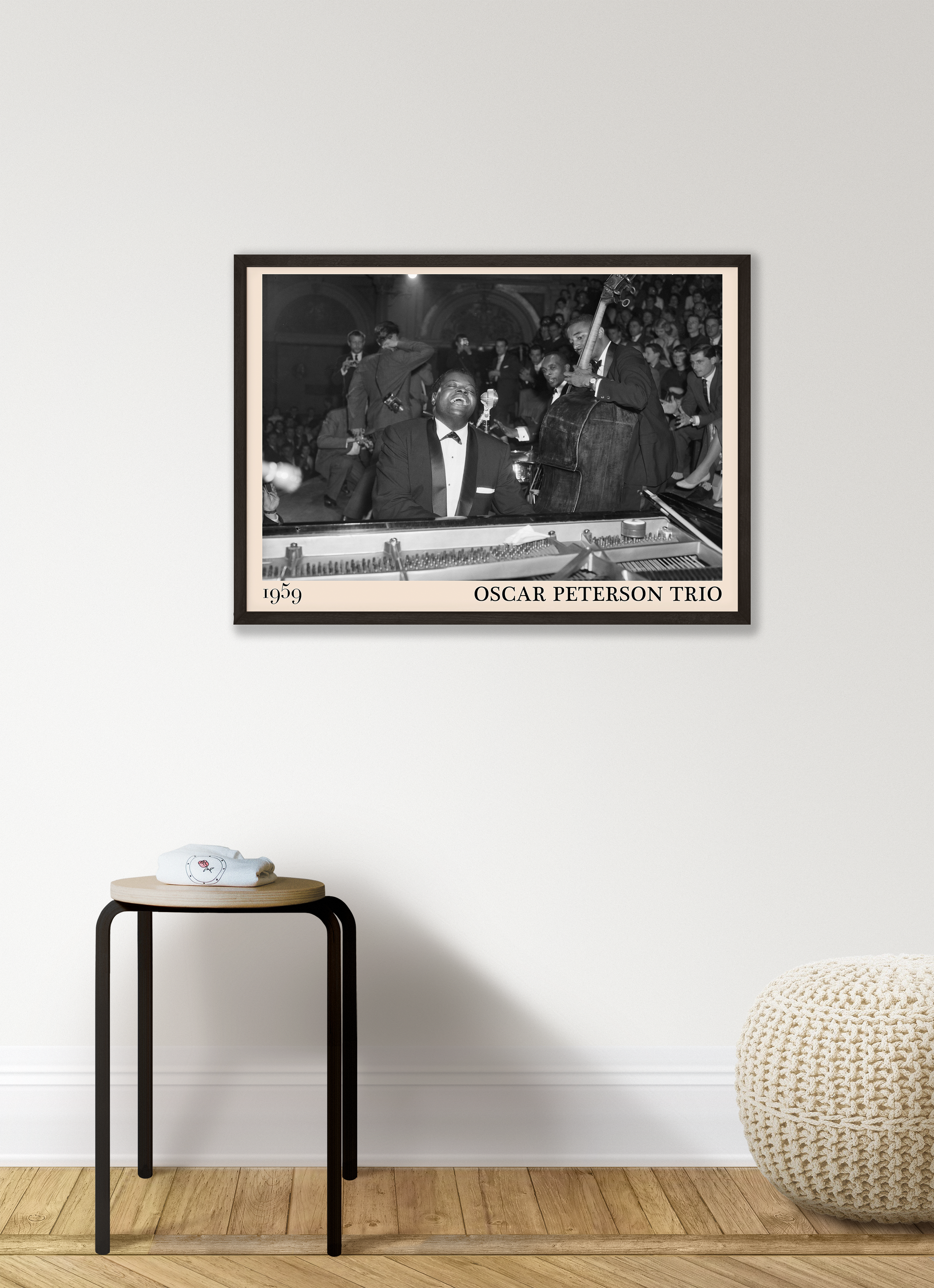 1959 picture of the Oscar Peterson Trio. Picture crafted into a retro black framed jazz print, with an off-white border. Poster is hanging on a grey living wall