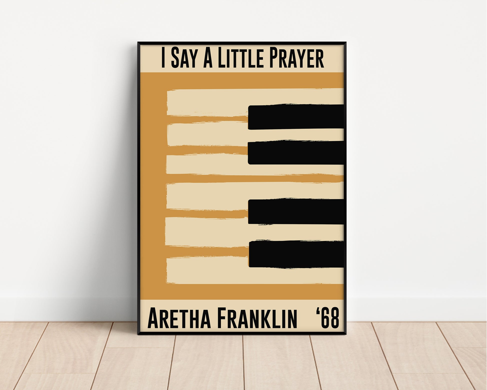 Framed  yellow jazz poster featuring a piano design and Aretha Franklin's 1968 song 'I Say a Little Prayer'. Vintage music decor, classic soul art, perfect for jazz and soul enthusiasts and Aretha Franklin fans