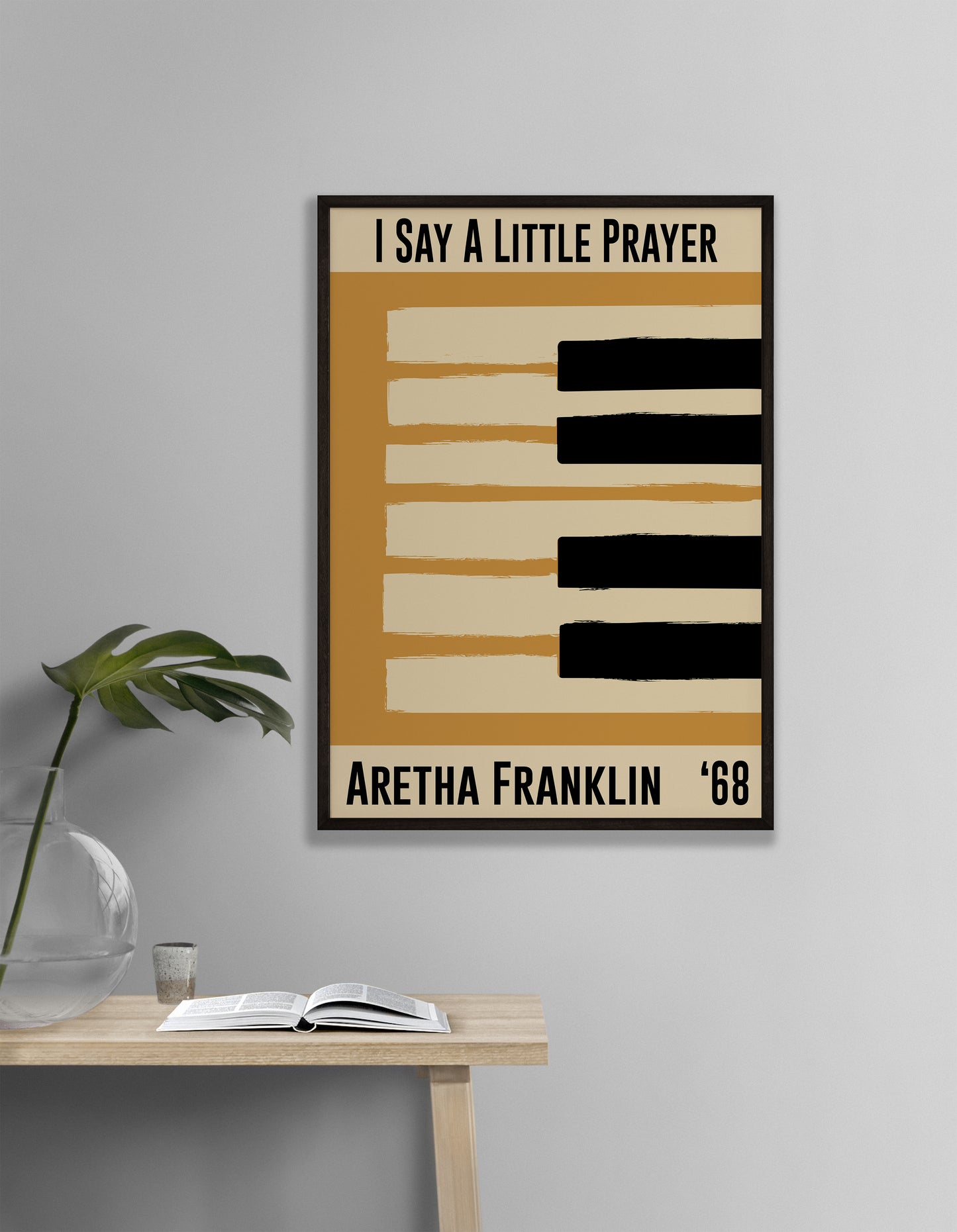 Framed  yellow jazz poster featuring a piano design and Aretha Franklin's 1968 song 'I Say a Little Prayer'. Vintage music decor, classic soul art, perfect for jazz and soul enthusiasts and Aretha Franklin fans