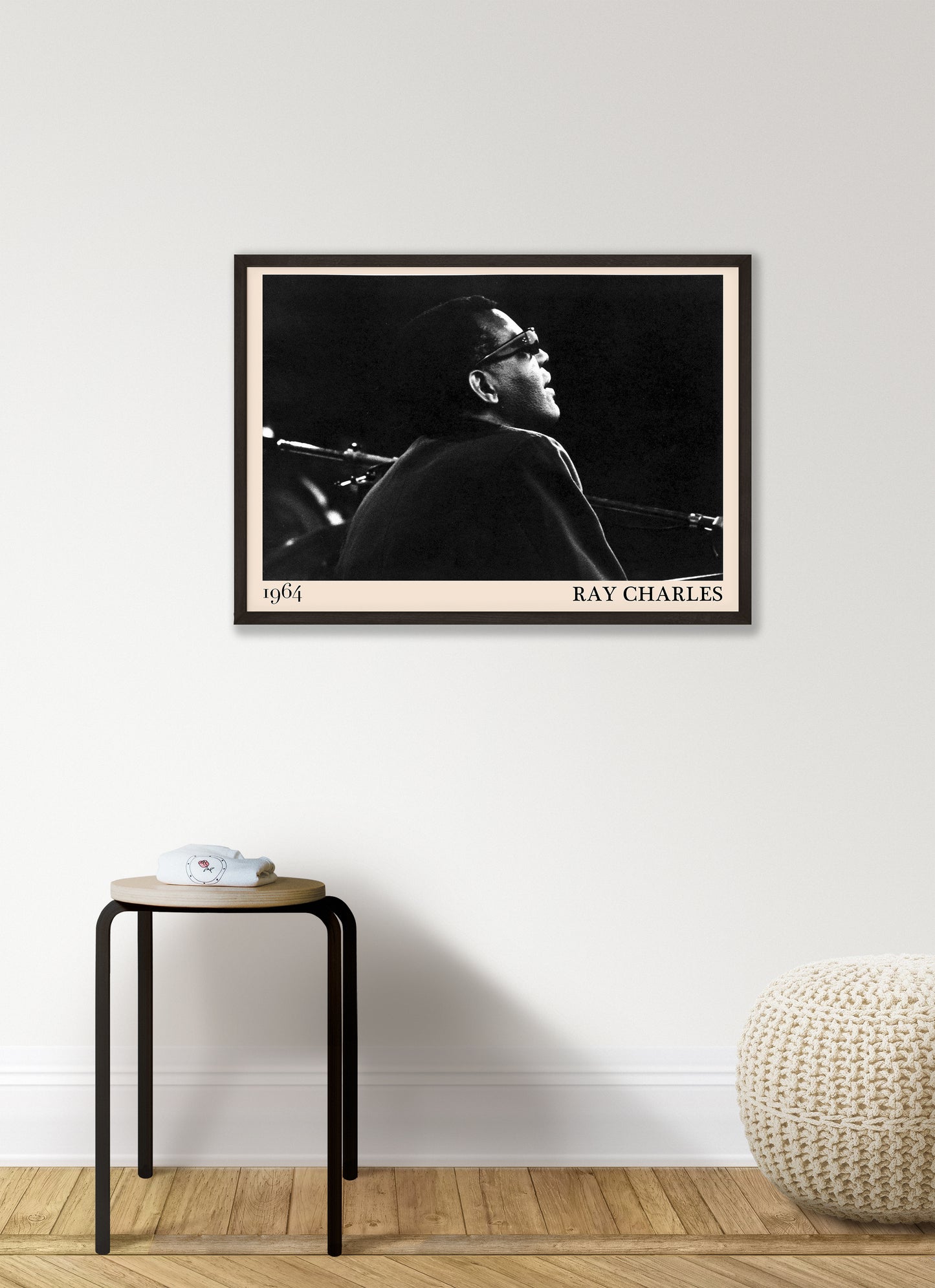  1964 photograph of blues legend Ray Charles, transformed into a retro black-framed poster hanging on a white living room wall
