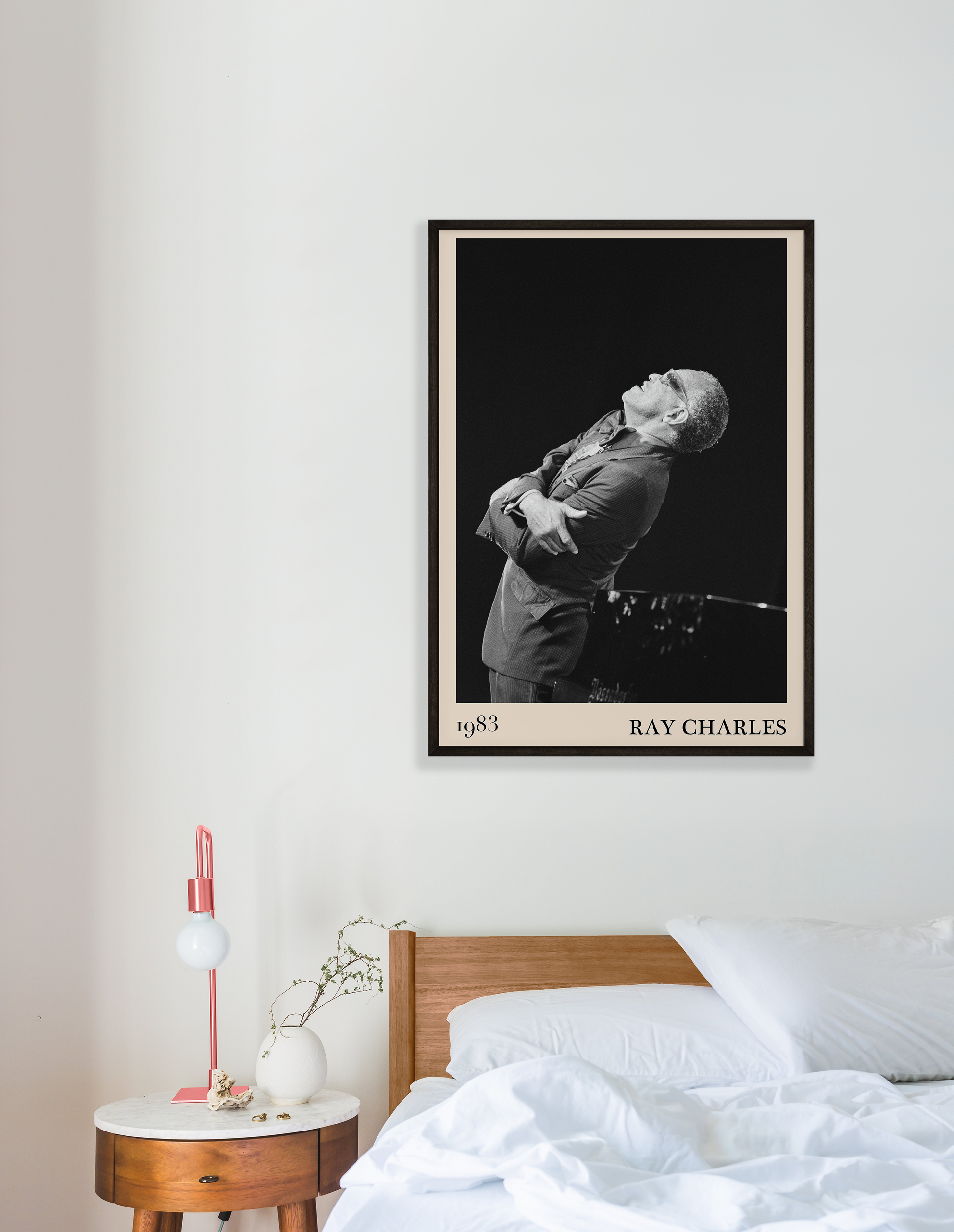 1983 photograph of Ray Charles singing, transformed into a stylish black-framed jazz poster leaning on white bedroom wall