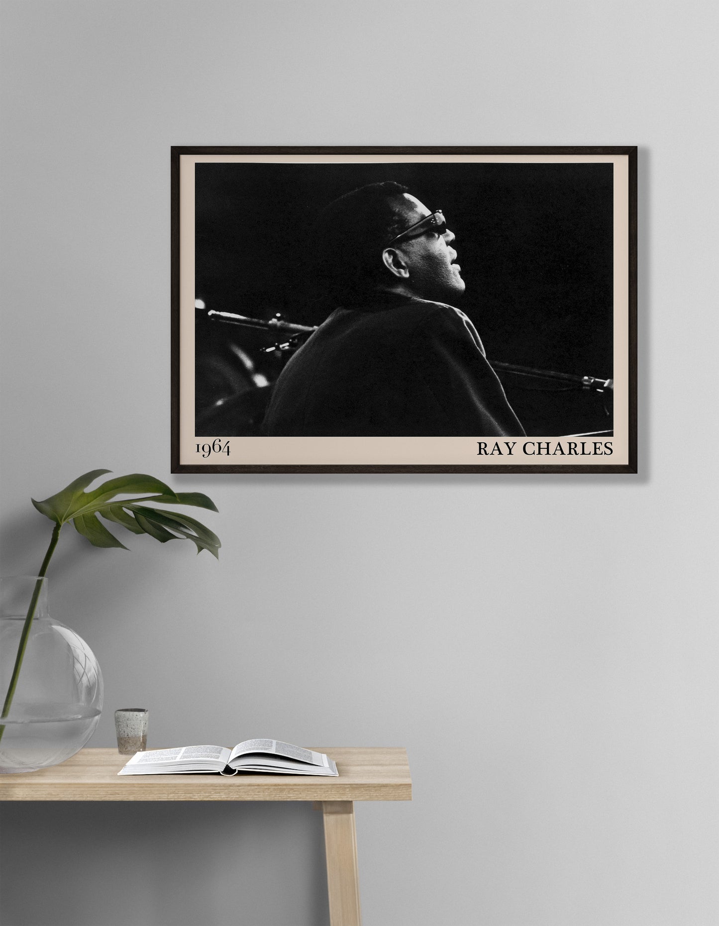 1964 photograph of blues legend Ray Charles, transformed into a cool black-framed poster hanging on a white living room wall