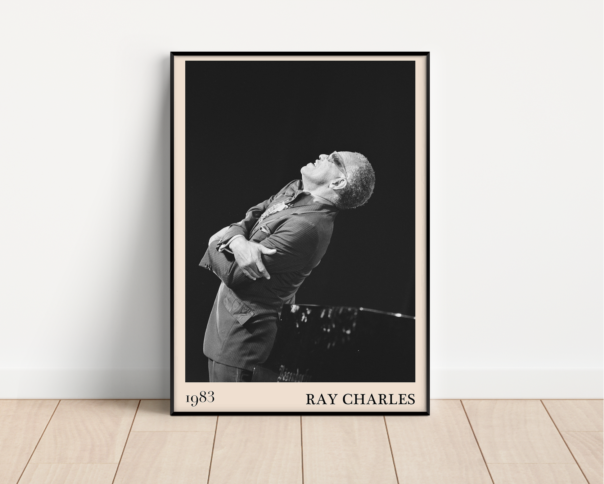 1983 photograph of Ray Charles singing, transformed into a stylish black-framed jazz poster leaning against a white wall