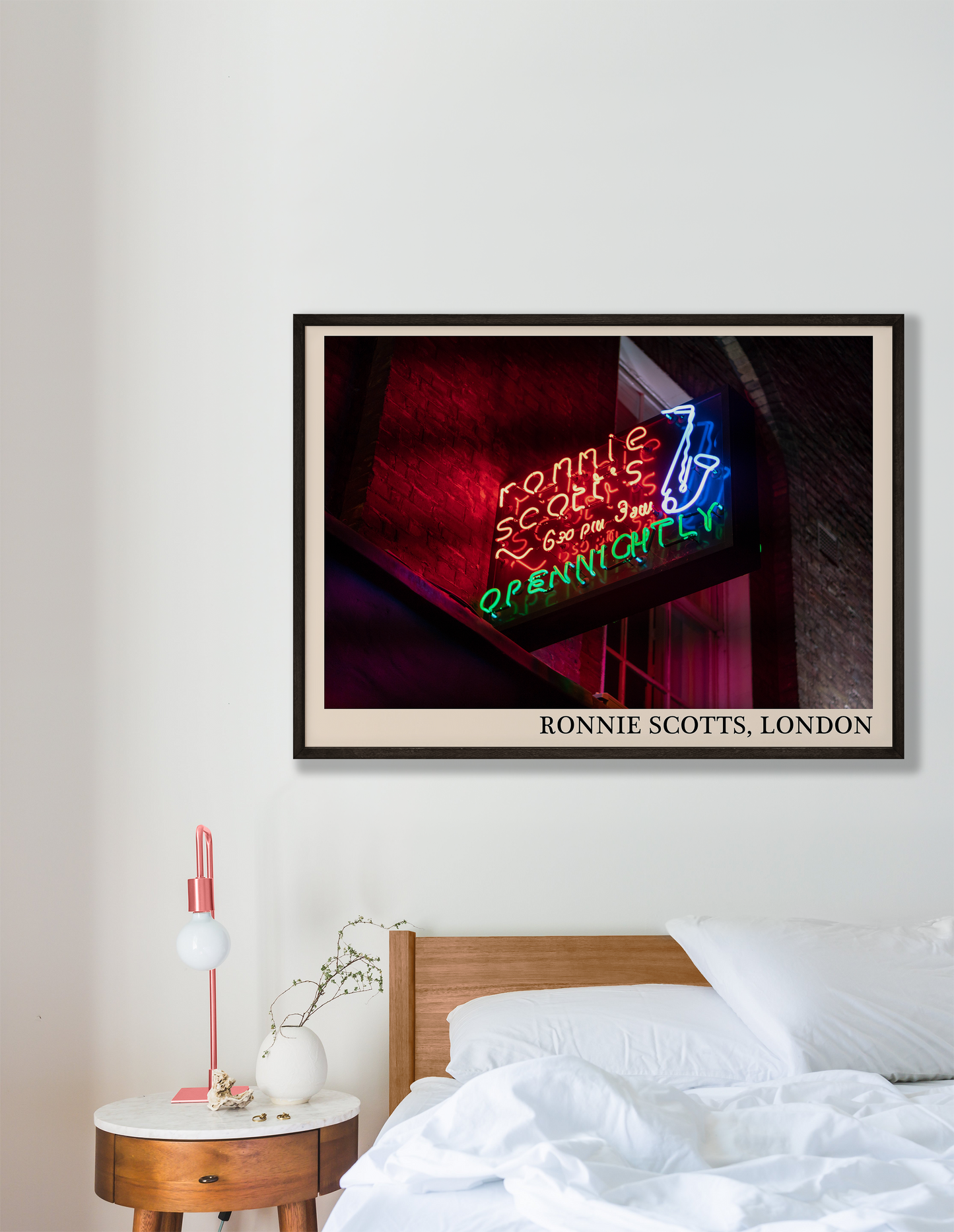 Iconic photo of Ronnie Scotts jazz club in London. Picture crafted into a cool black framed jazz print, with an off-white border. Poster is hanging on a grey bedroom wall