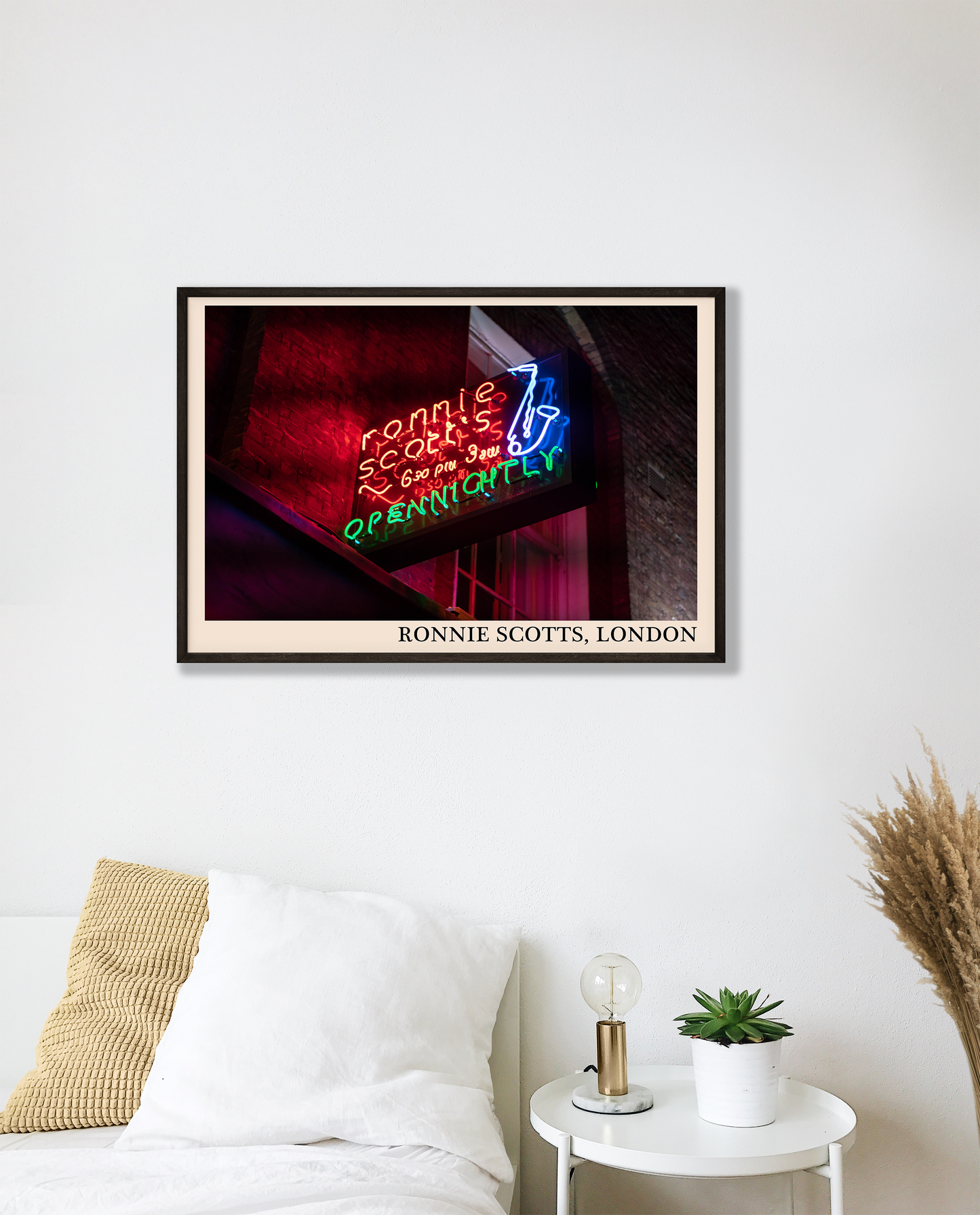 Iconic photo of Ronnie Scotts jazz club in London. Picture crafted into a cool black framed music poster, with an off-white border. Poster is hanging on a white bedroom wall