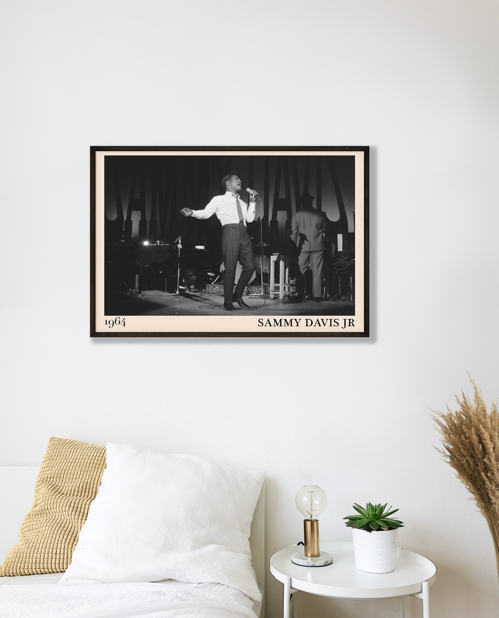 1964 picture of Sammy Davis Jr singing. Picture crafted into a cool black framed music poster, with an off-white border. Poster is hanging on a white bedroom wall