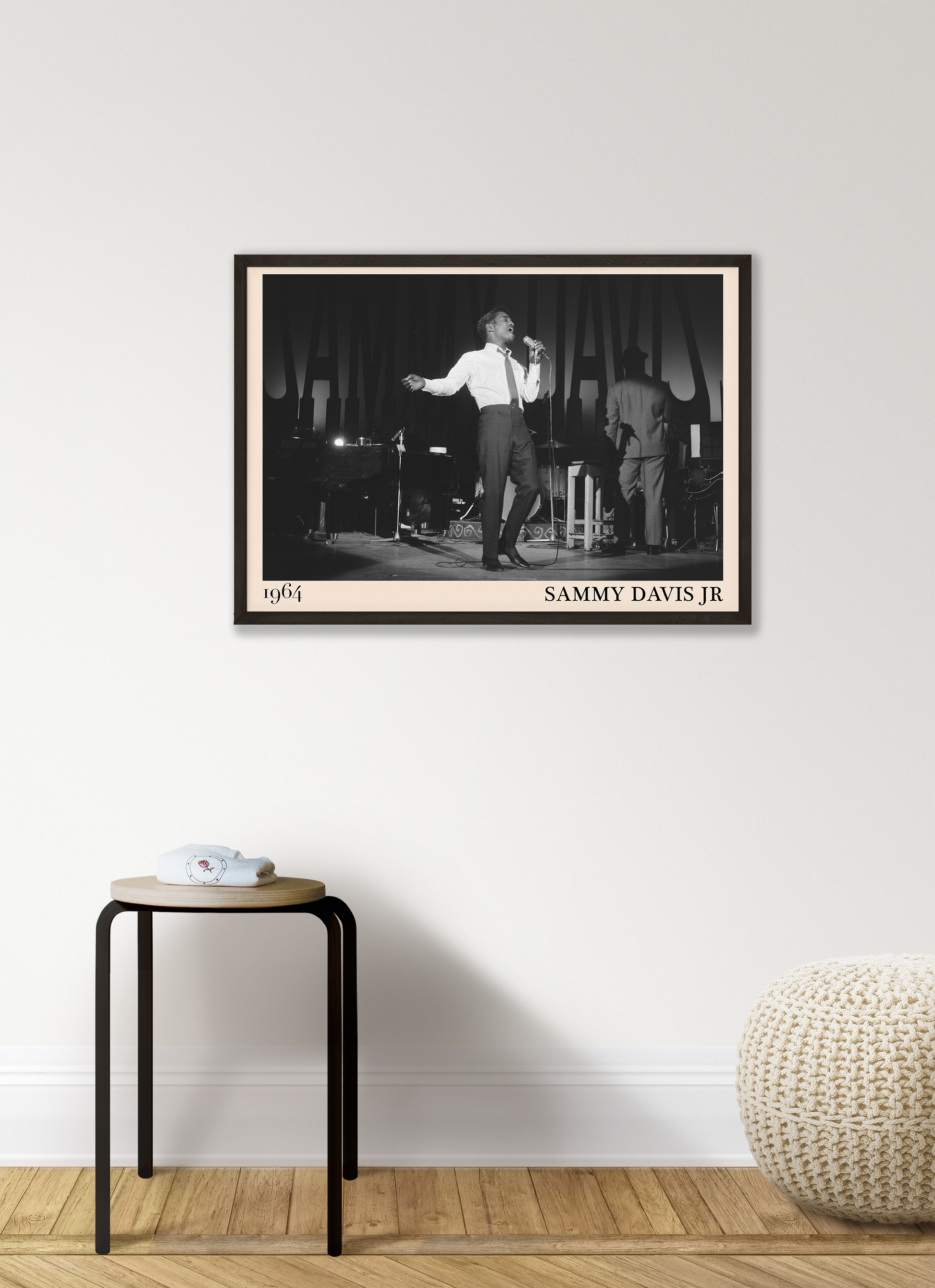 1964 picture of Sammy Davis Jr singing. Picture crafted into a retro black framed jazz print, with an off-white border. Poster is hanging on a grey living wall