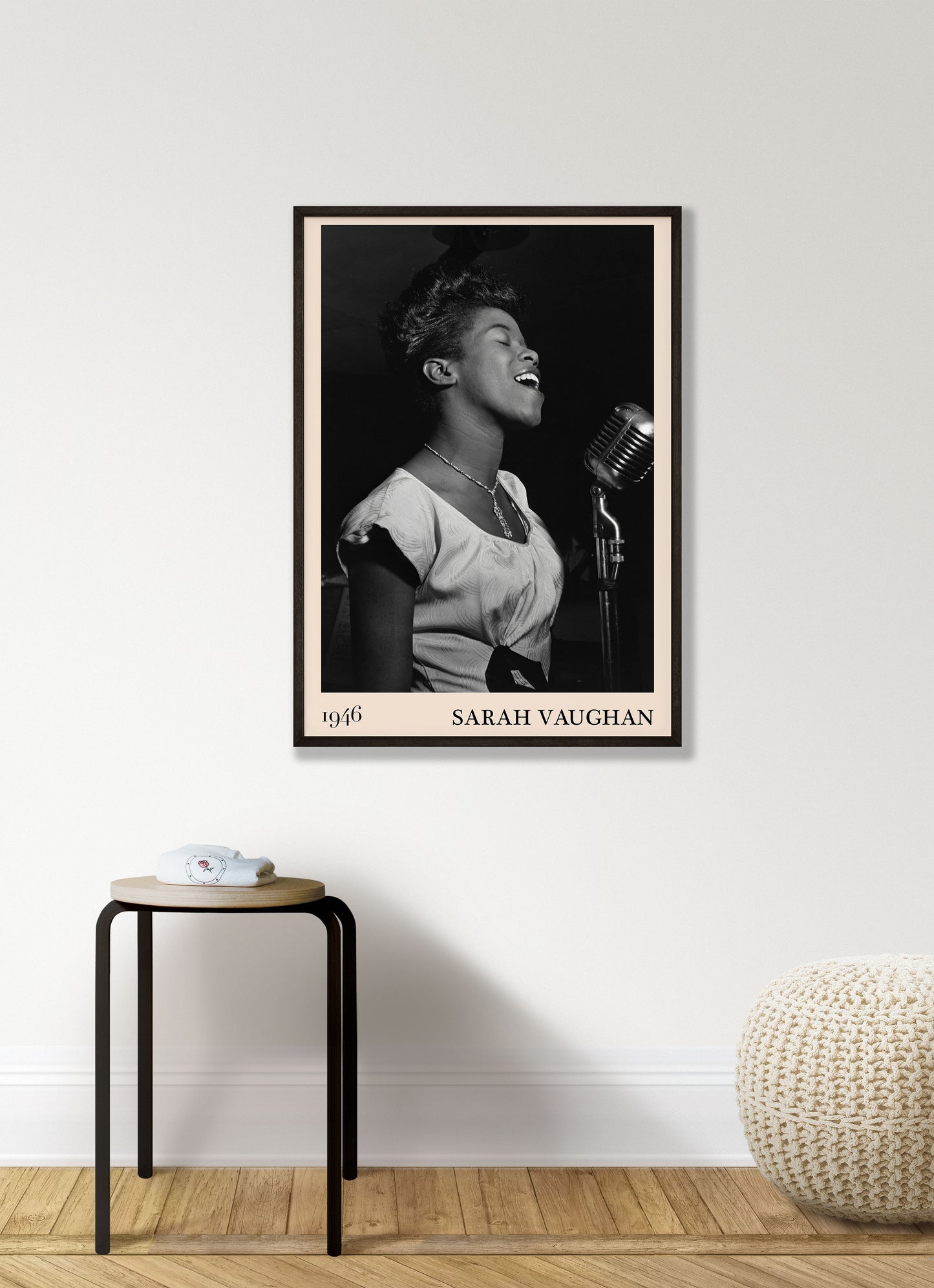 1946 photograph of Sarah Vaughan crafted into a retro black framed jazz poster. The poster is hanging on a white living room wall.