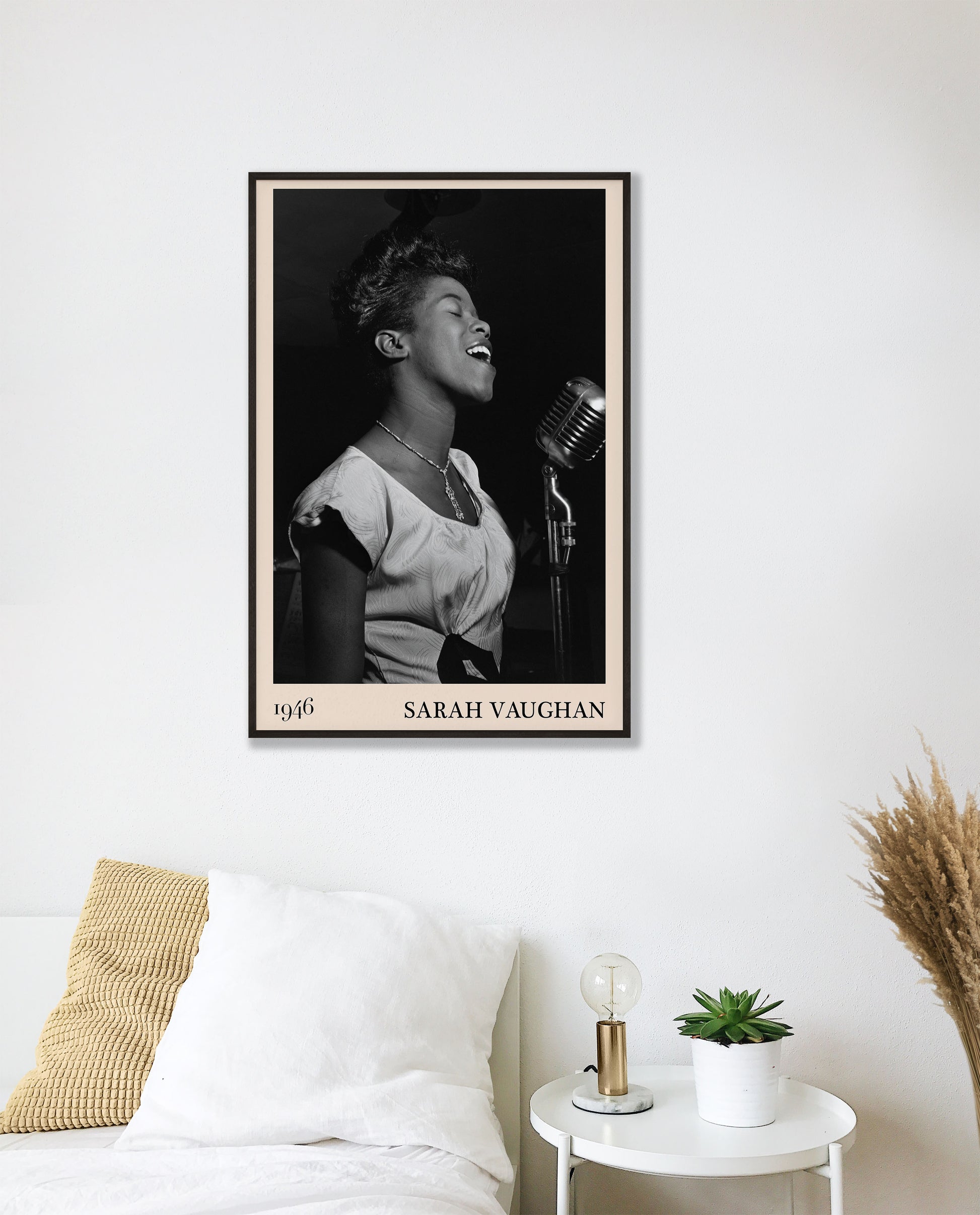 1946 photograph of Sarah Vaughan crafted into a cool black framed music poster. The poster is hanging on a white bedroom wall.