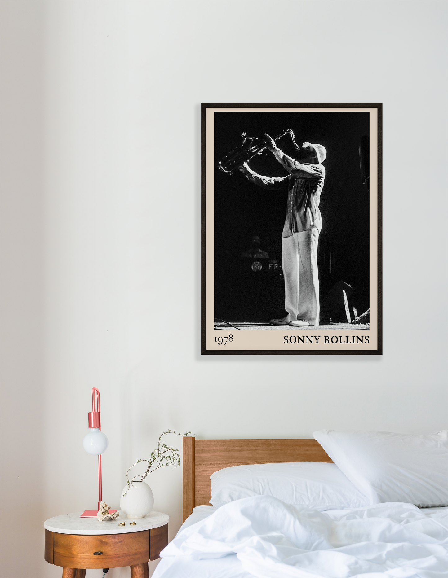 1978 photograph of Sonny Rollins playing the saxophone, transformed into a stylish black-framed jazz poster hanging on a white bedroom wall