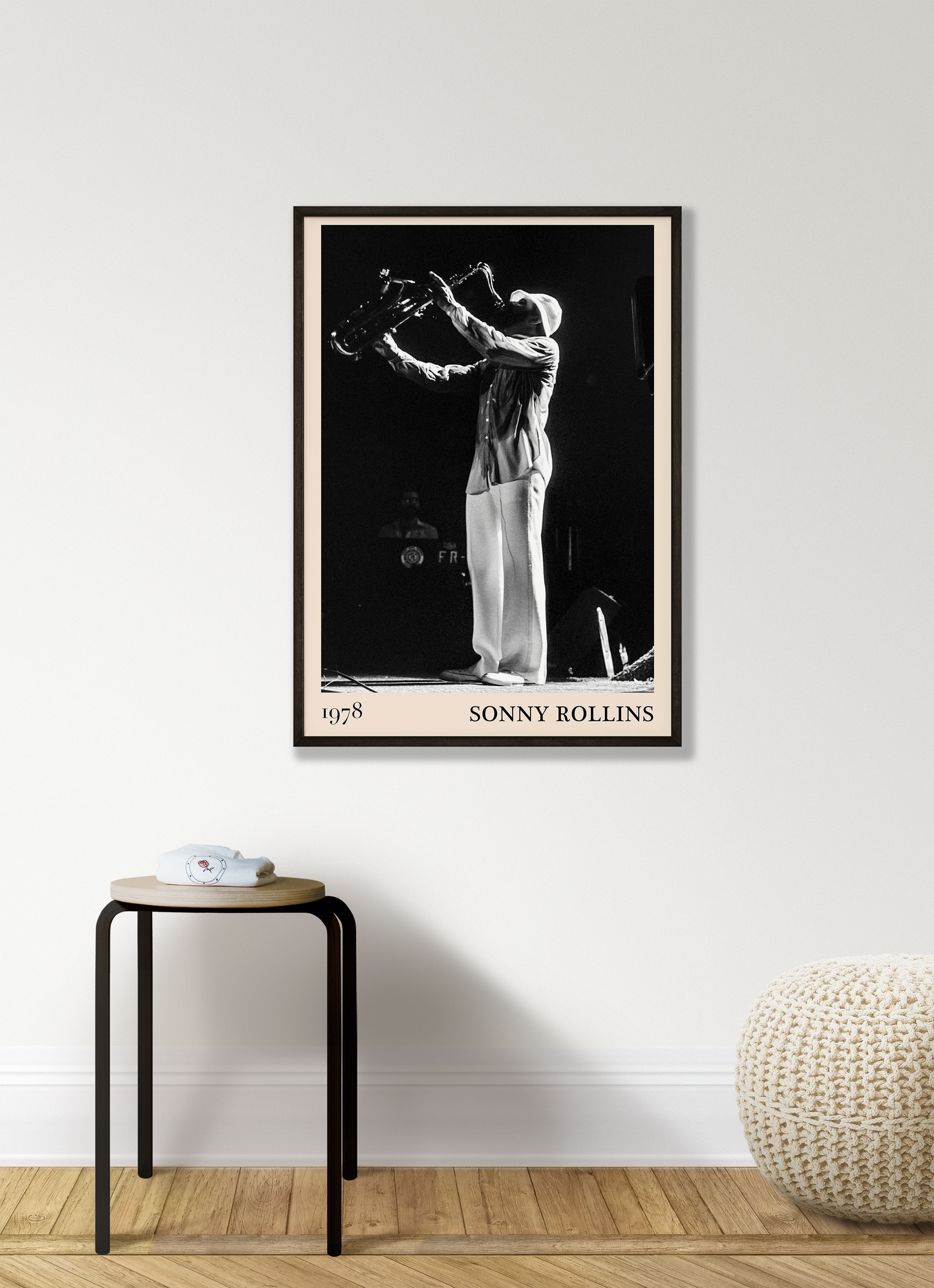 1978 photograph of Sonny Rollins playing the saxophone, transformed into a stylish black-framed jazz print hanging on a grey living room wall
