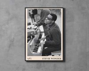 1967 photo of Stevie Wonder, crafted into an elegant black-framed print. Hanging on a concrete wall
