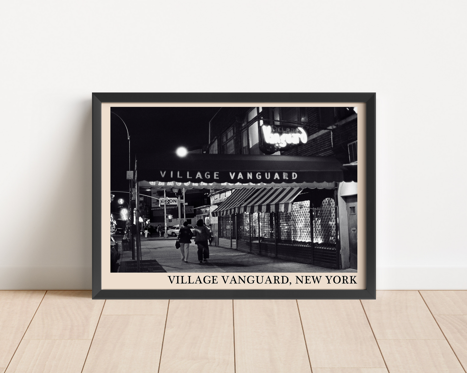 Iconic photo of Village Vanguard in New York taken by Thomas Marcello and captured in a retro black framed jazz poster, leaning against a white wall