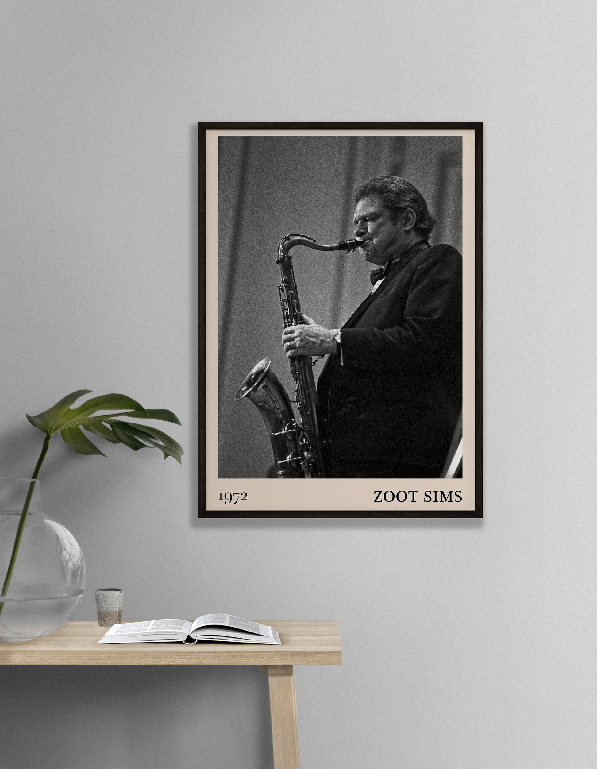 1972 photo of the Zoot Sims crafted into a black framed-poster, hanging on a white living room wall