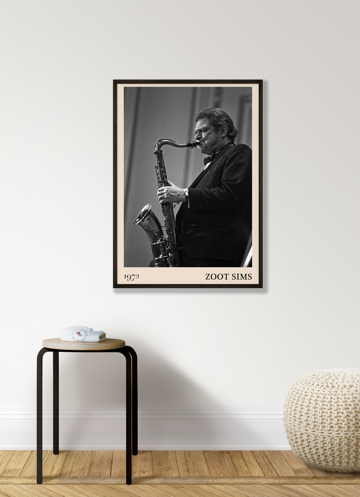 1972 photo of the Zoot Sims crafted into a black framed-poster, hanging on a white living room wall