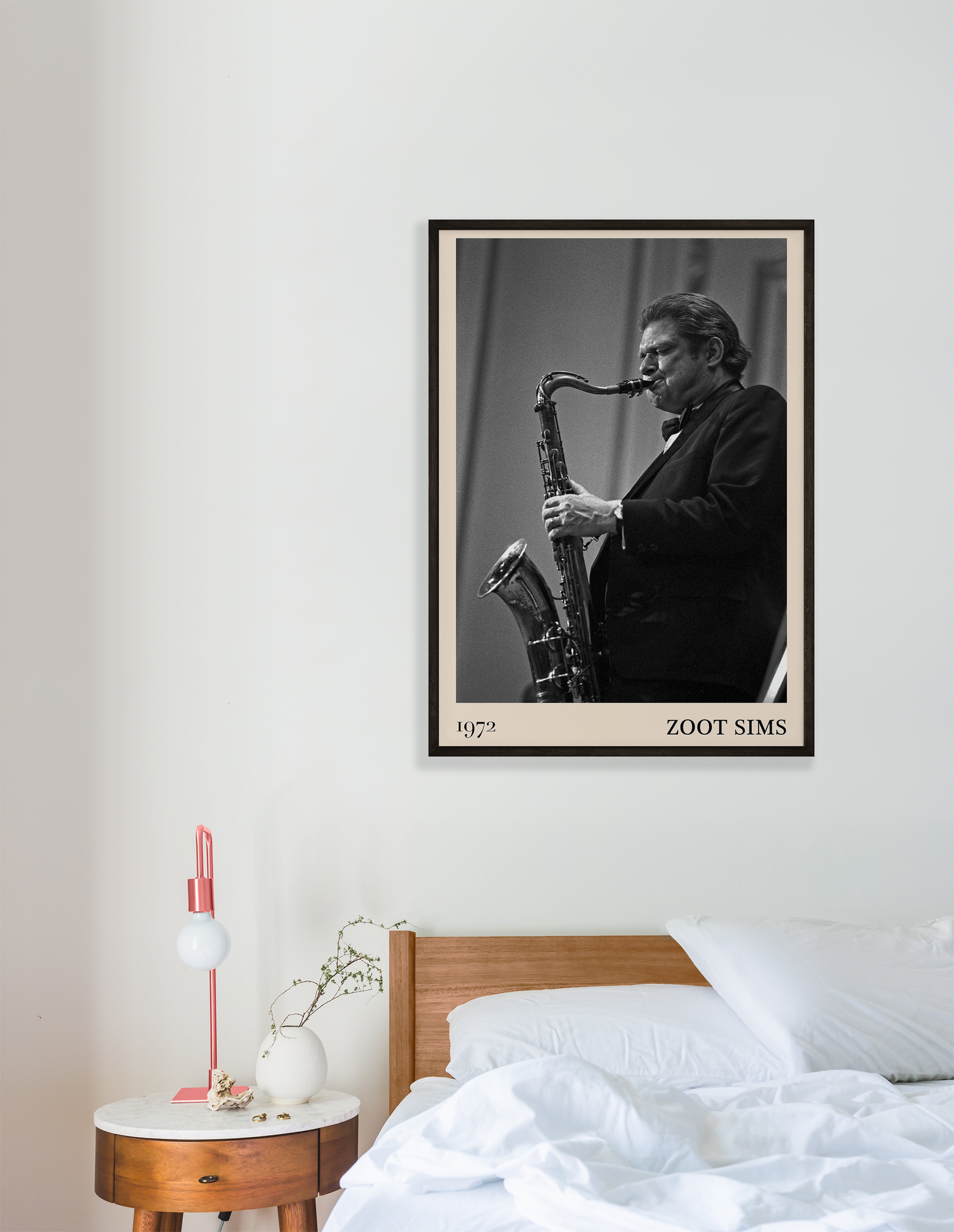 1972 photo of the Zoot Sims crafted into a black framed-poster, hanging on a white bedroom wall