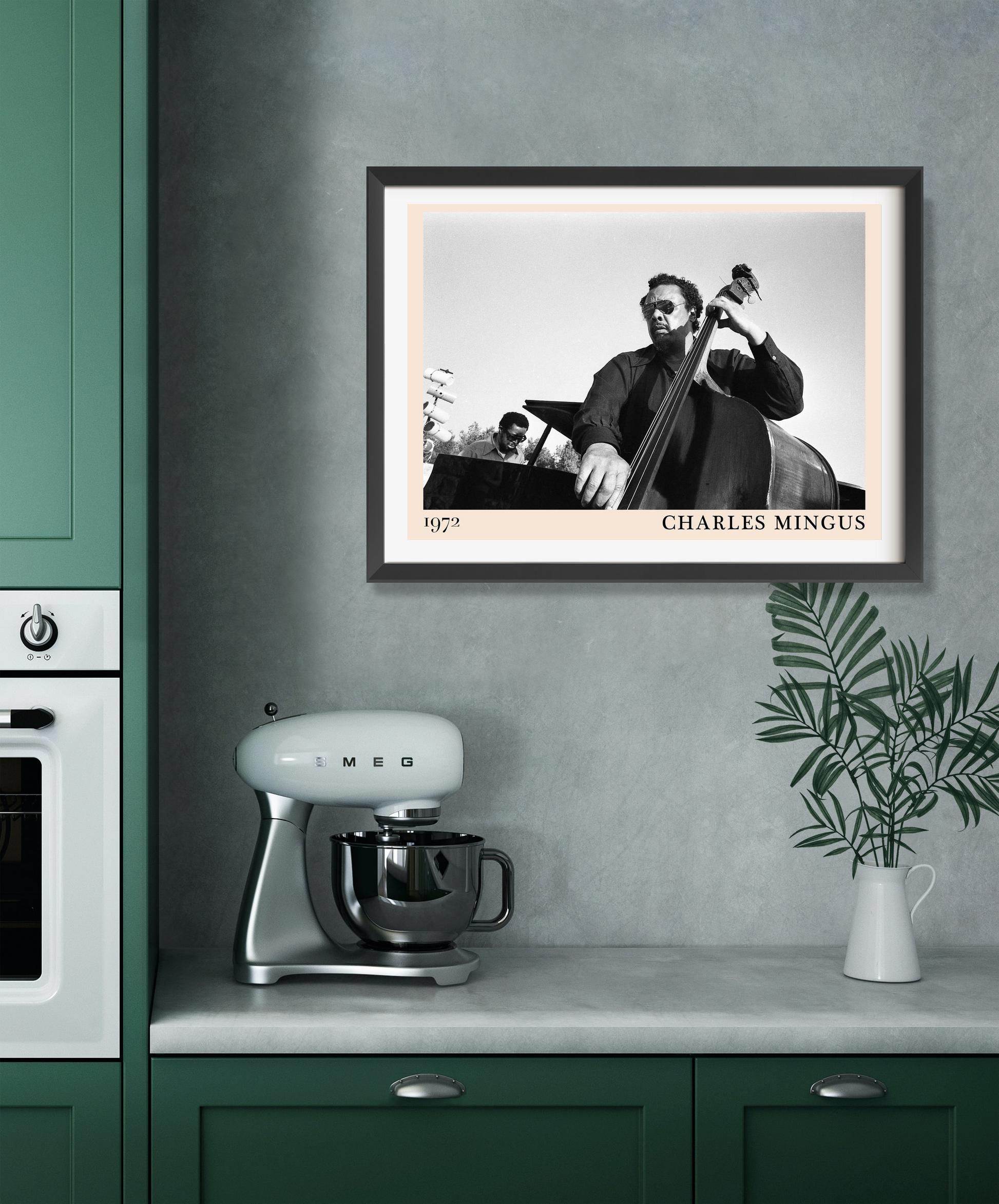 Charles Mingus Cool Jazz Poster in landscape 22 mount, black and white jazz design framed above modern green kitchen counter.