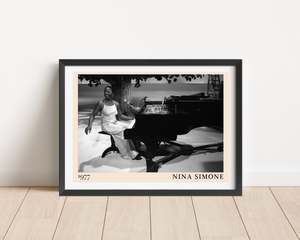 Nina Simone vintage poster in landscape mount mockup, black and white piano scene, framed on minimalist wood floor.