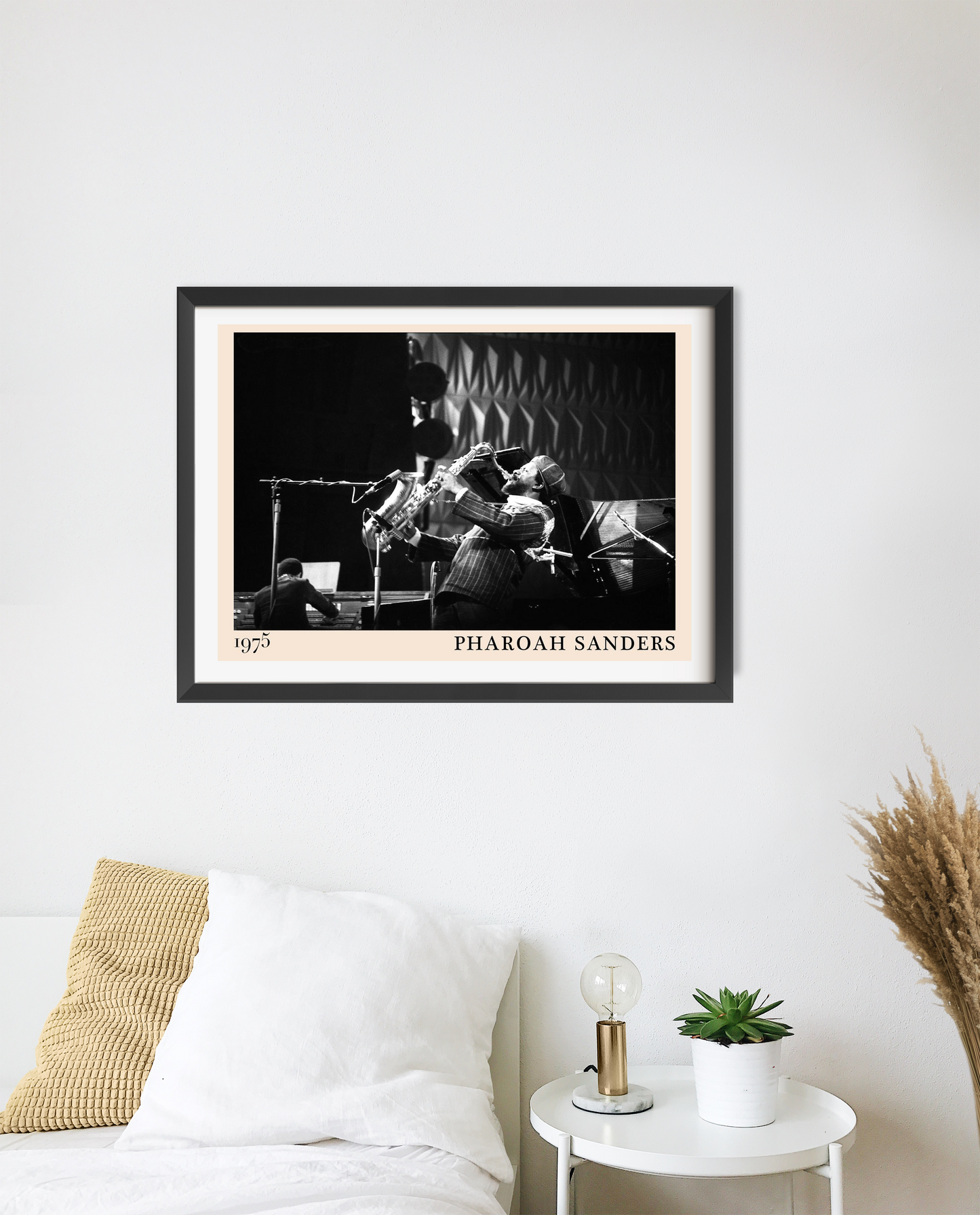 Pharoah Sanders vintage jazz poster in a landscape 20 mount mockup above a bed, featuring a black and white concert photo.