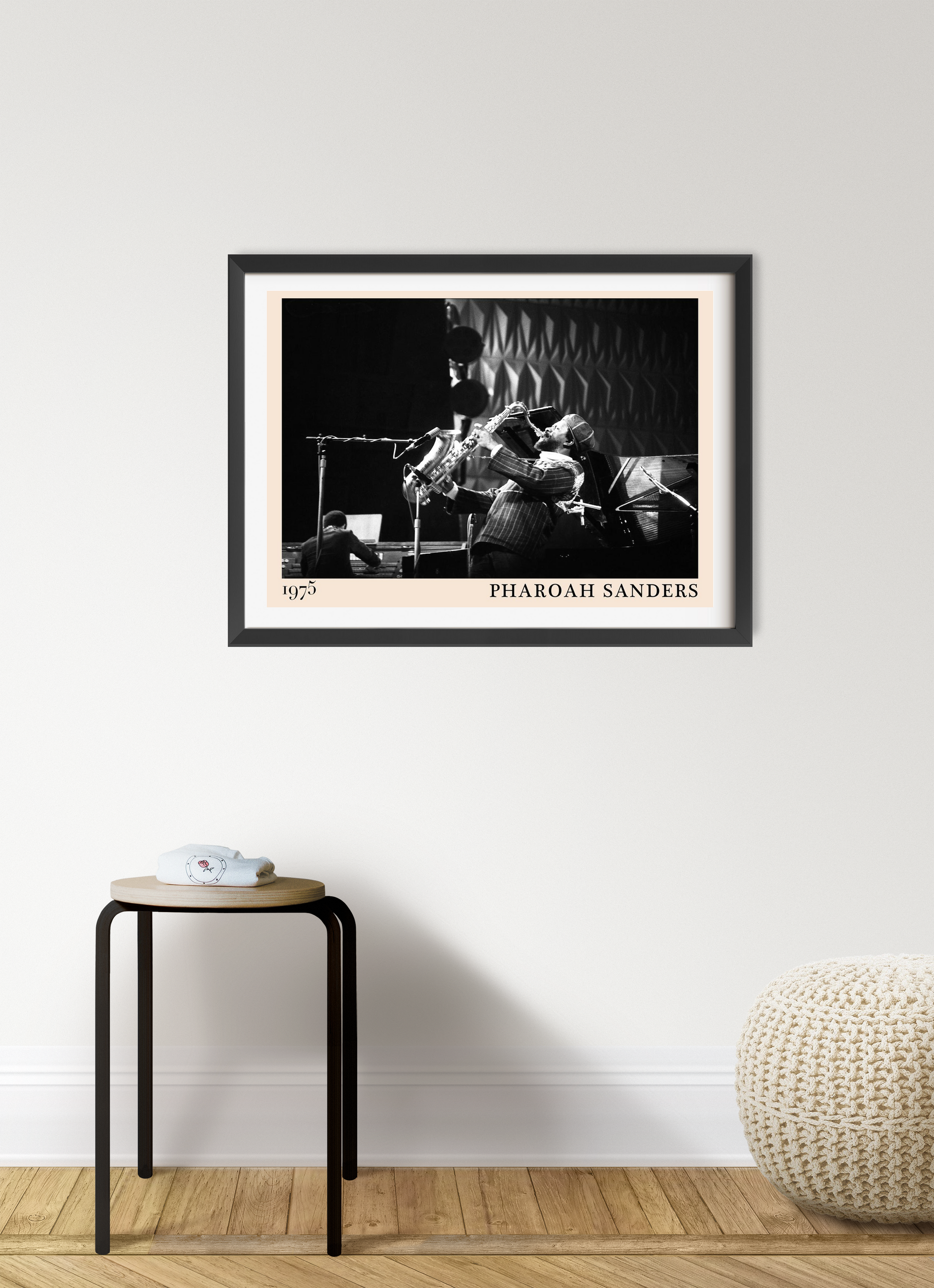 Pharoah Sanders vintage jazz poster in landscape mount mockup, black and white design framed on modern living room wall.